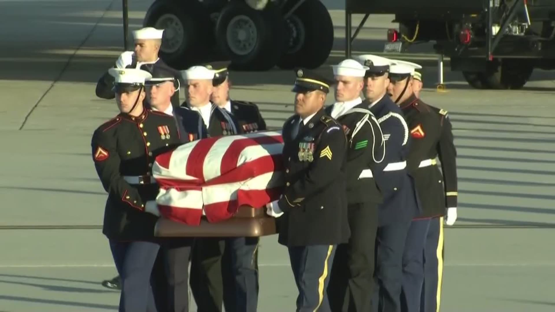 A short ceremony at Joint Base Andrews featured a 21 gun salute and the playing of 'Hail to the Chief' as the body of George H.W. Bush arrived from Texas.