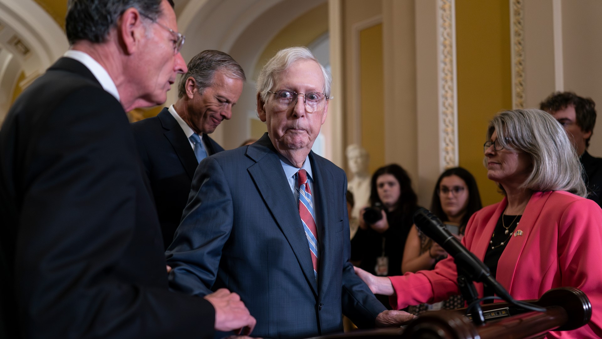 Sen. Mitch McConnell abruptly stopped speaking Wednesday during a press event at the U.S. Capitol. He later returned and assured reporters he was ok.