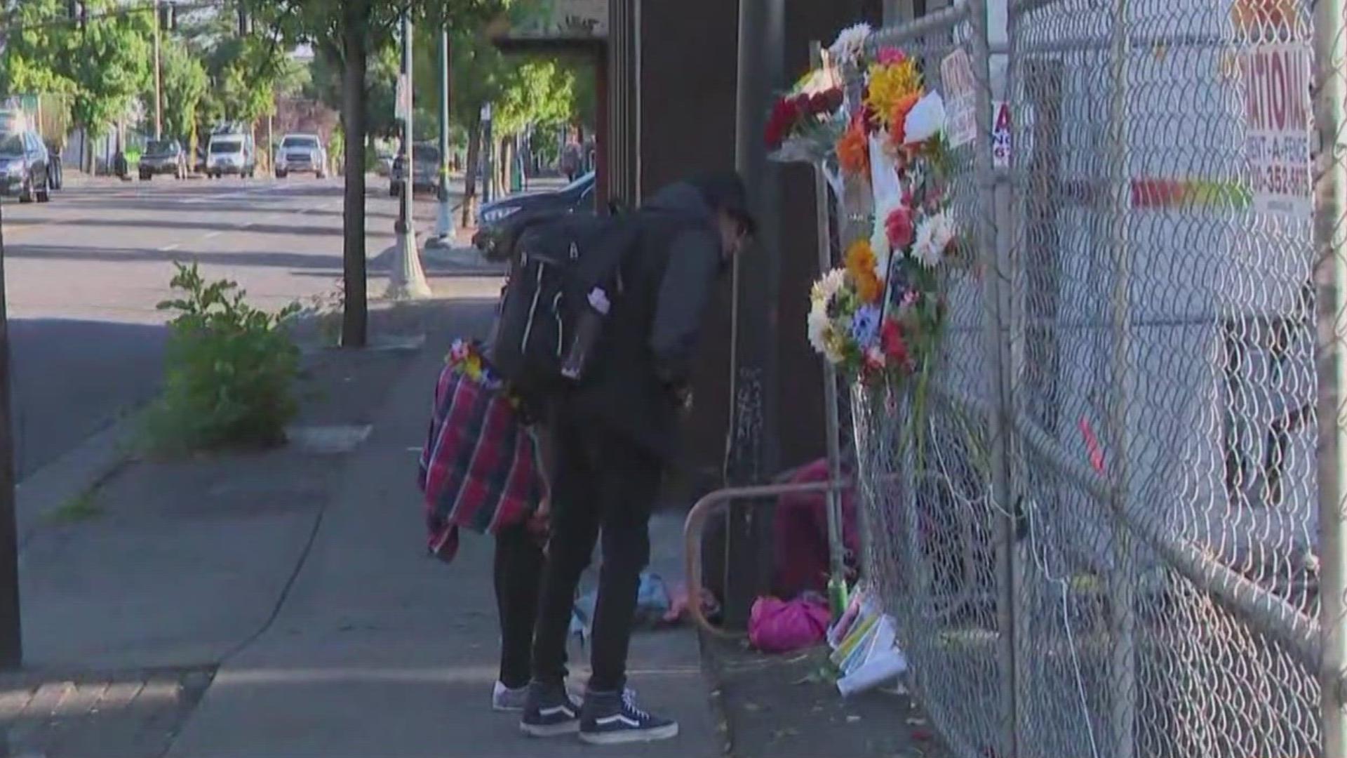 People have left candles, posters and flowers at a makeshift memorial honoring a pedestrian who was hit and killed on Martin Luther King Jr. Boulevard on Thursday.