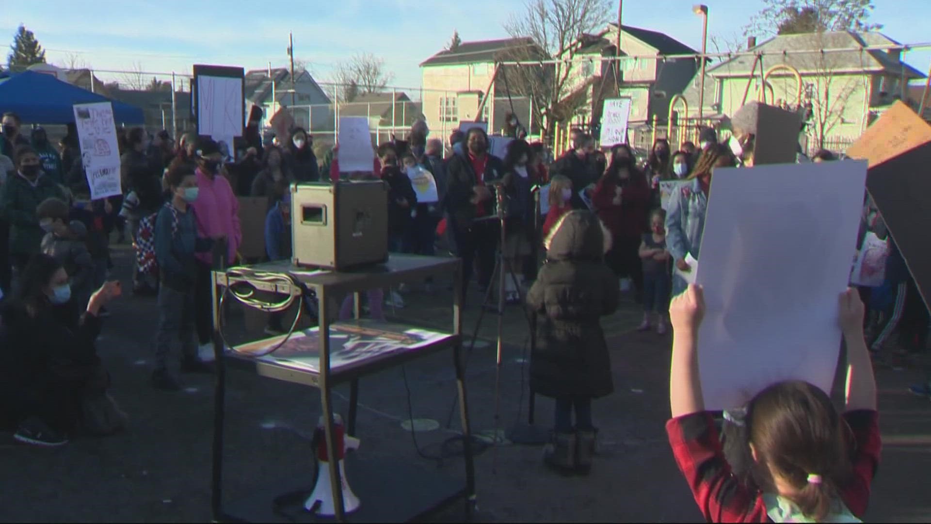 Hundreds rallied to encourage district officials to take the school out of consideration as a possible relocation site for Harriet Tubman Middle School.