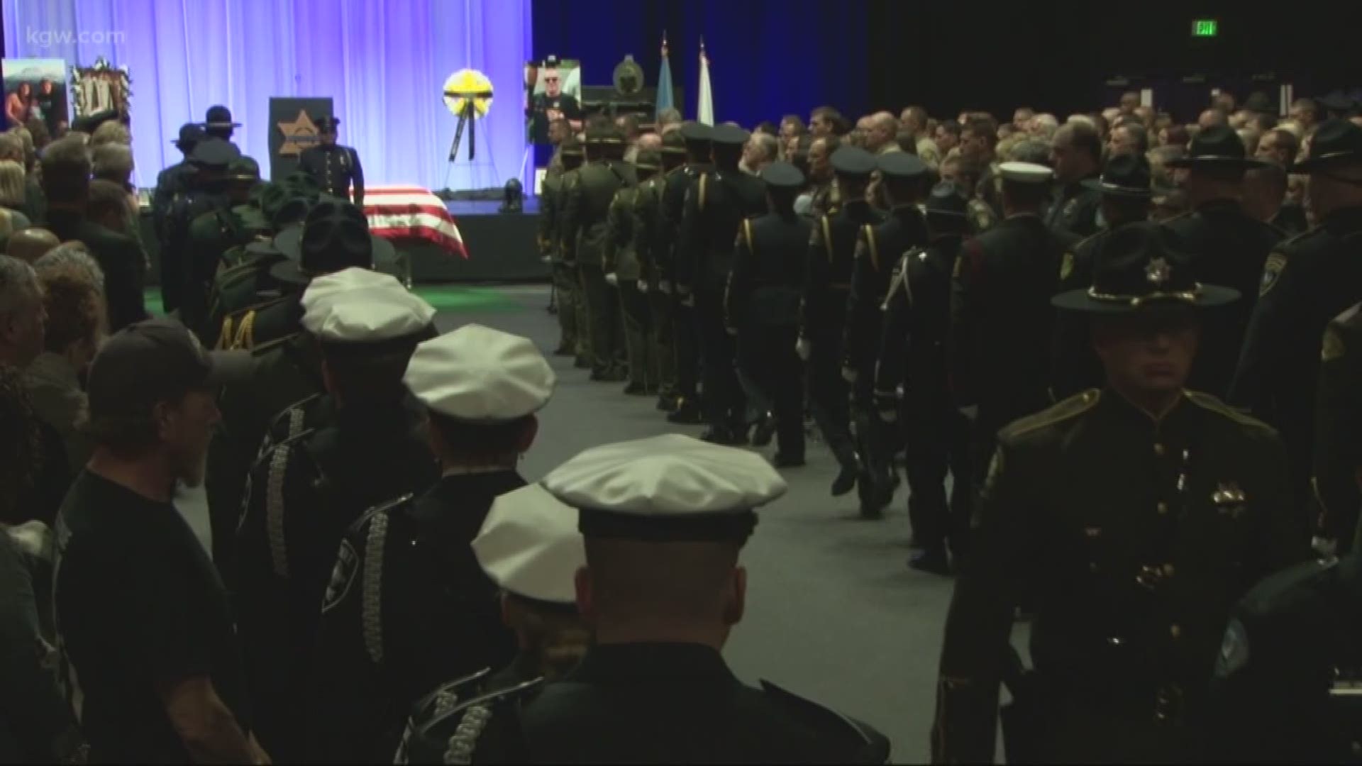 A memorial for fallen Cowlitz County sheriff’s deputy Justin DeRosier was held at the Chiles Center in Portland.