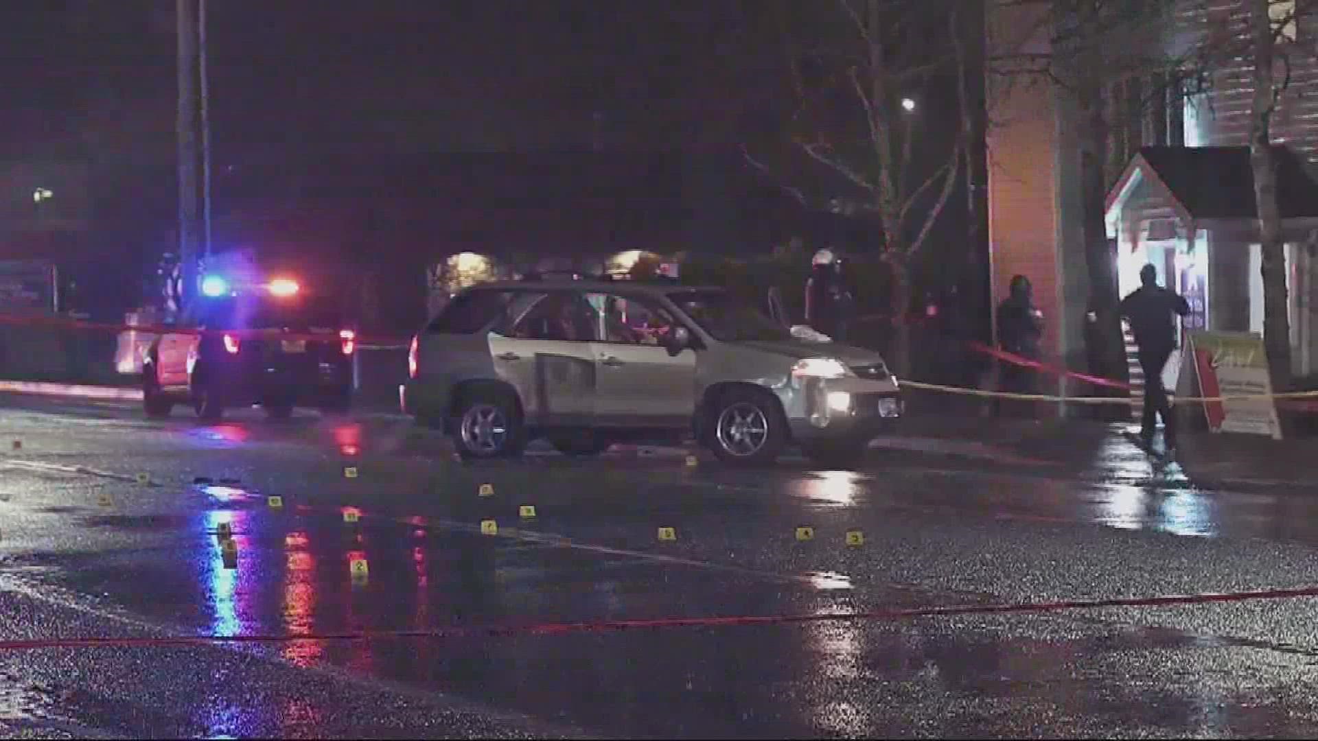 A woman was killed and three others, including her two children, were shot in a vehicle in Southeast Portland on Sunday night.