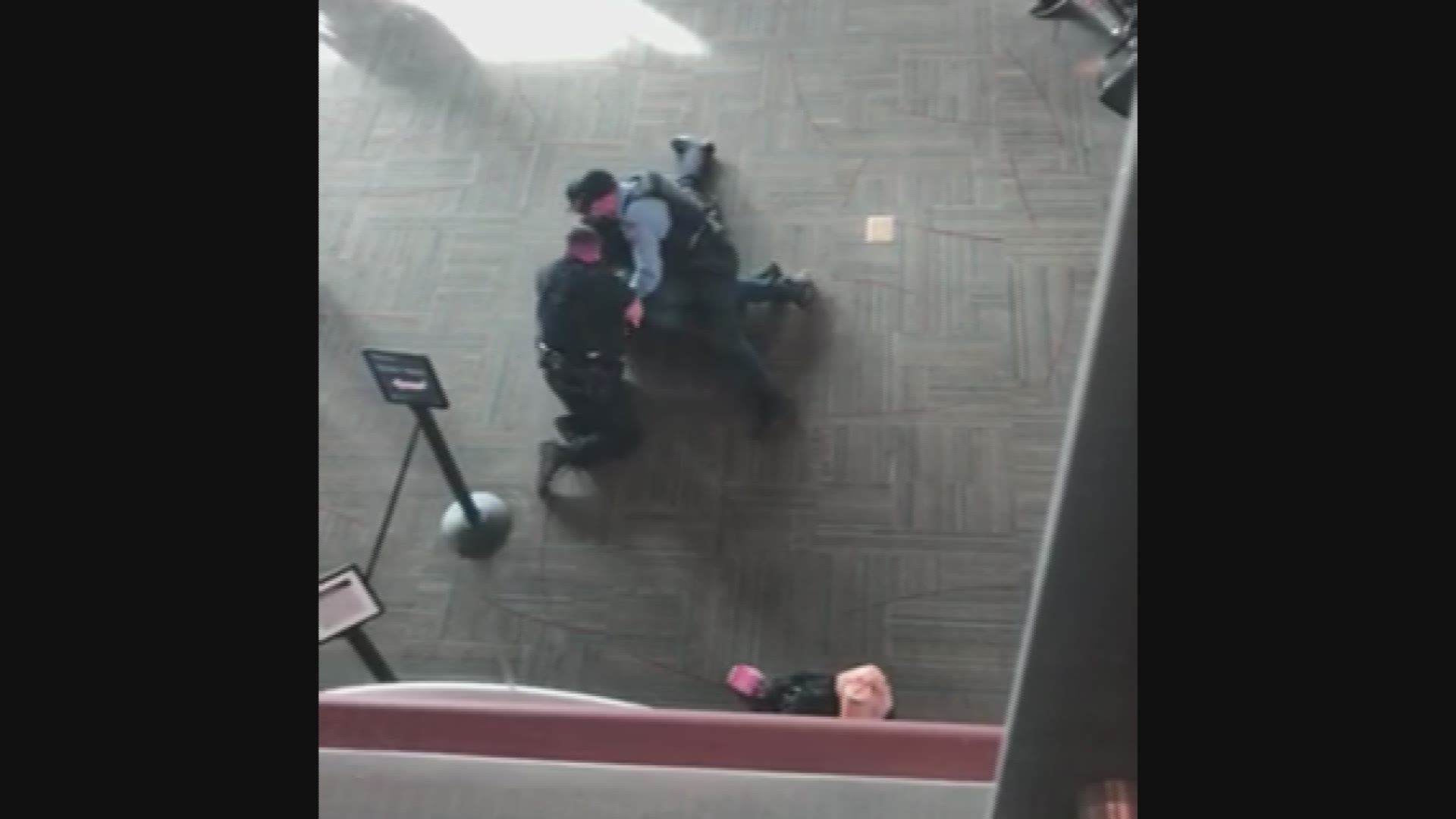 A man who police say was armed with a gun was arrested at the Medford, Oregon airport on Jan. 10, 2019. Video courtesy of Thomas Busch.