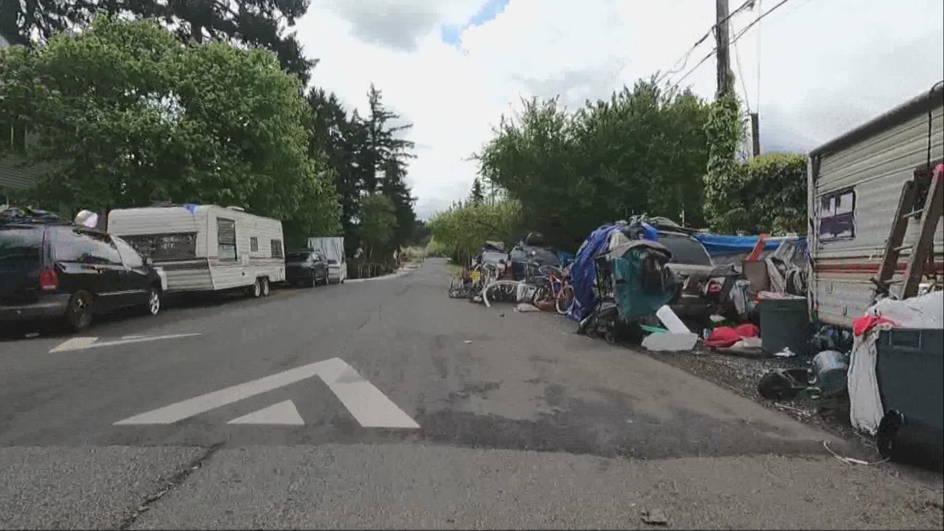 The camp on 157th and Division has grown in recent years. Nearby apartment residents say they encounter violence and property damage on a weekly basis.