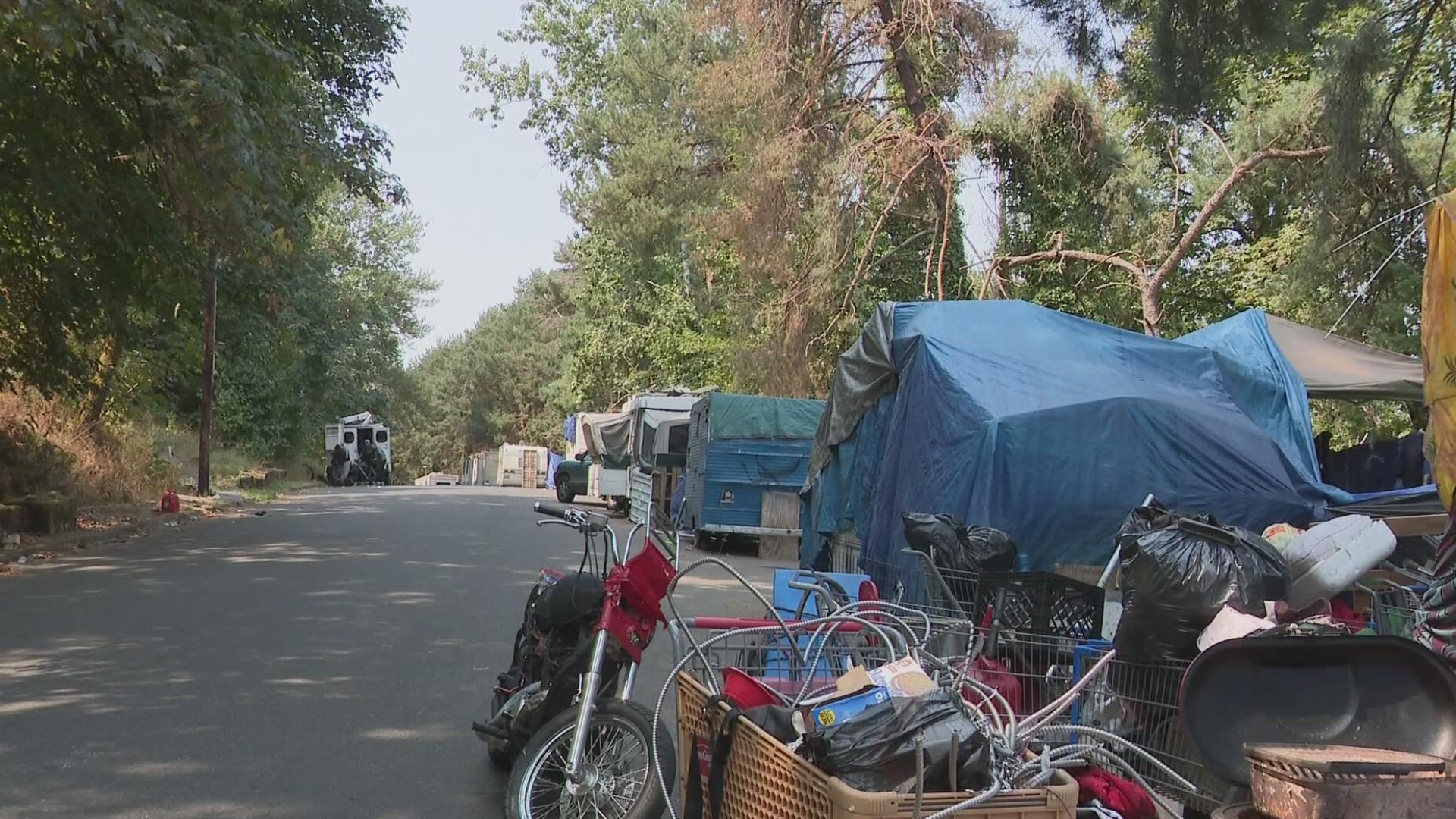 Neighbors who live around the homeless camp say things now feel like they're at a breaking point.