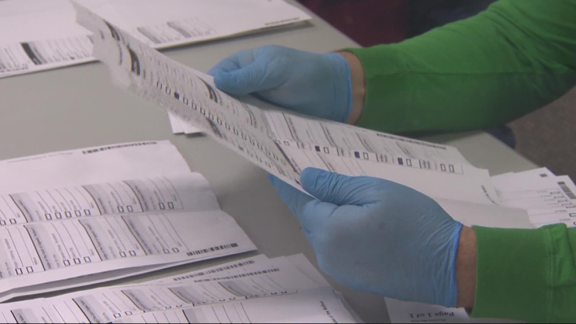 Thousands of ballots sent to Clackamas County voters were printed with an unreadable barcode. Now, hundreds of employees are working to process them by hand.