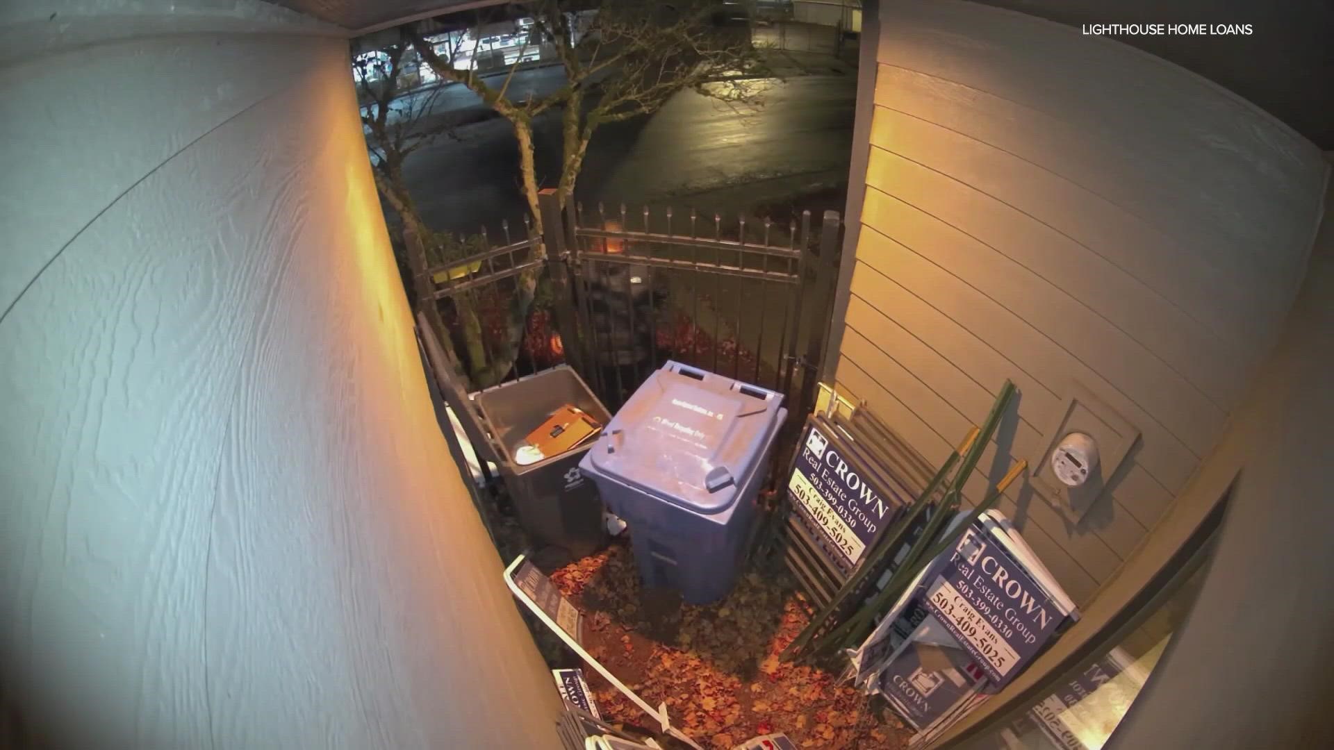 Camera caught someone reaching into a dumpster near Lighthouse Home Loans and lighting cardboard on fire. Minutes later, the flames spread to the building's side.