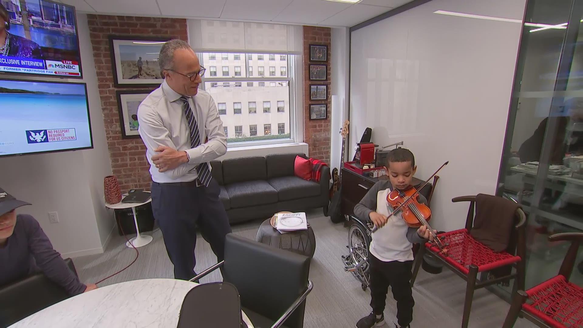 Jaden plays violin, bass with Lester Holt