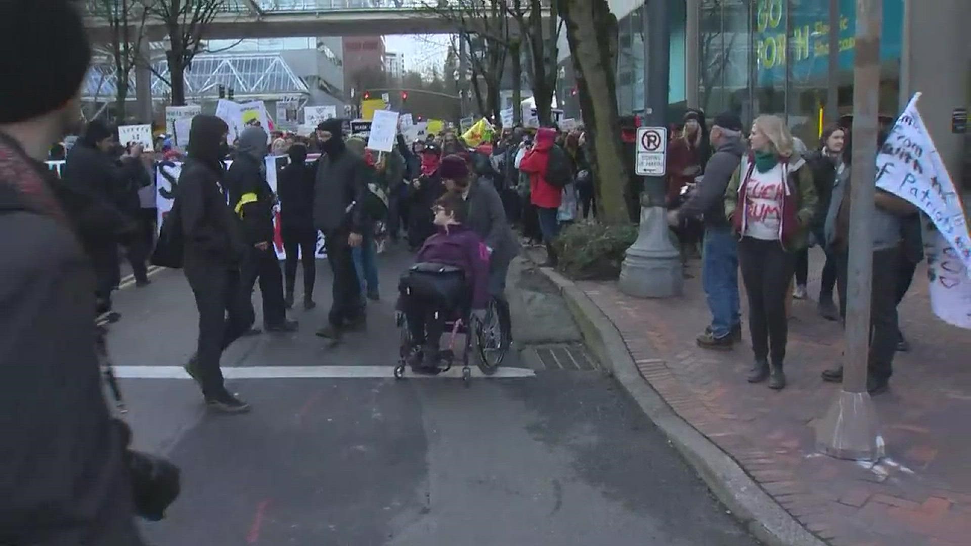 National March for Impeachment demonstrators march in downtown Portland on Jan. 20, 2018