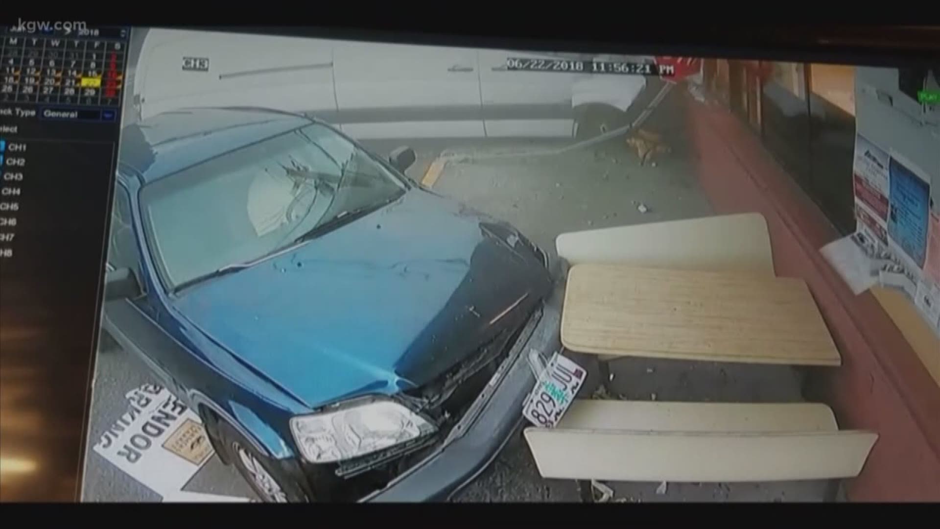 Video posted by Woodland police shows a van jump a curb and plow through a stopped car before smashing into the corner of the building.