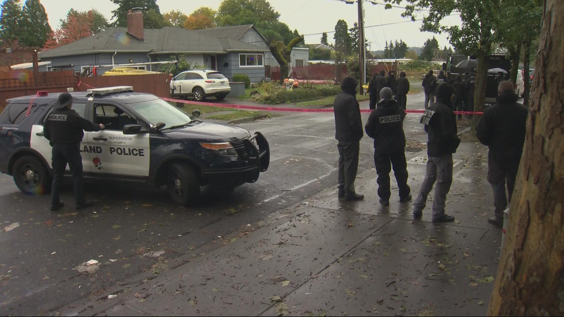 Portland police said that the man was alive and surrendered to officers some time after the initial shooting on SE 83rd Avenue.