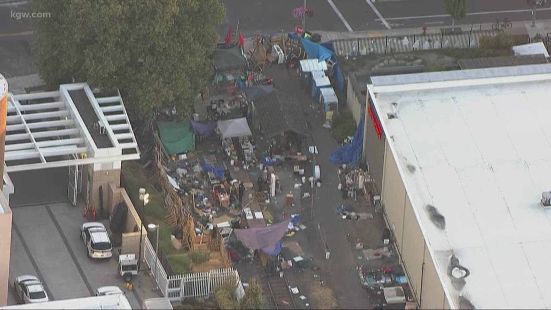 Portland police cleared out an occupation camp Wednesday morning outside the Portland ICE holding facility in Southwest Portland.