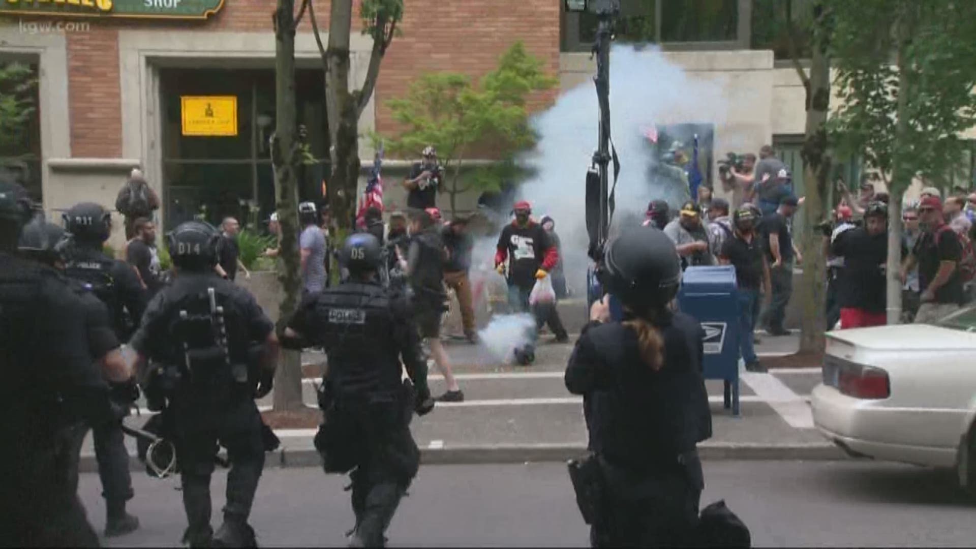 Four people arrested after dueling protests in downtown Portland on Saturday afternoon drew heavy police presence after a morning of peaceful unrelated rallies.