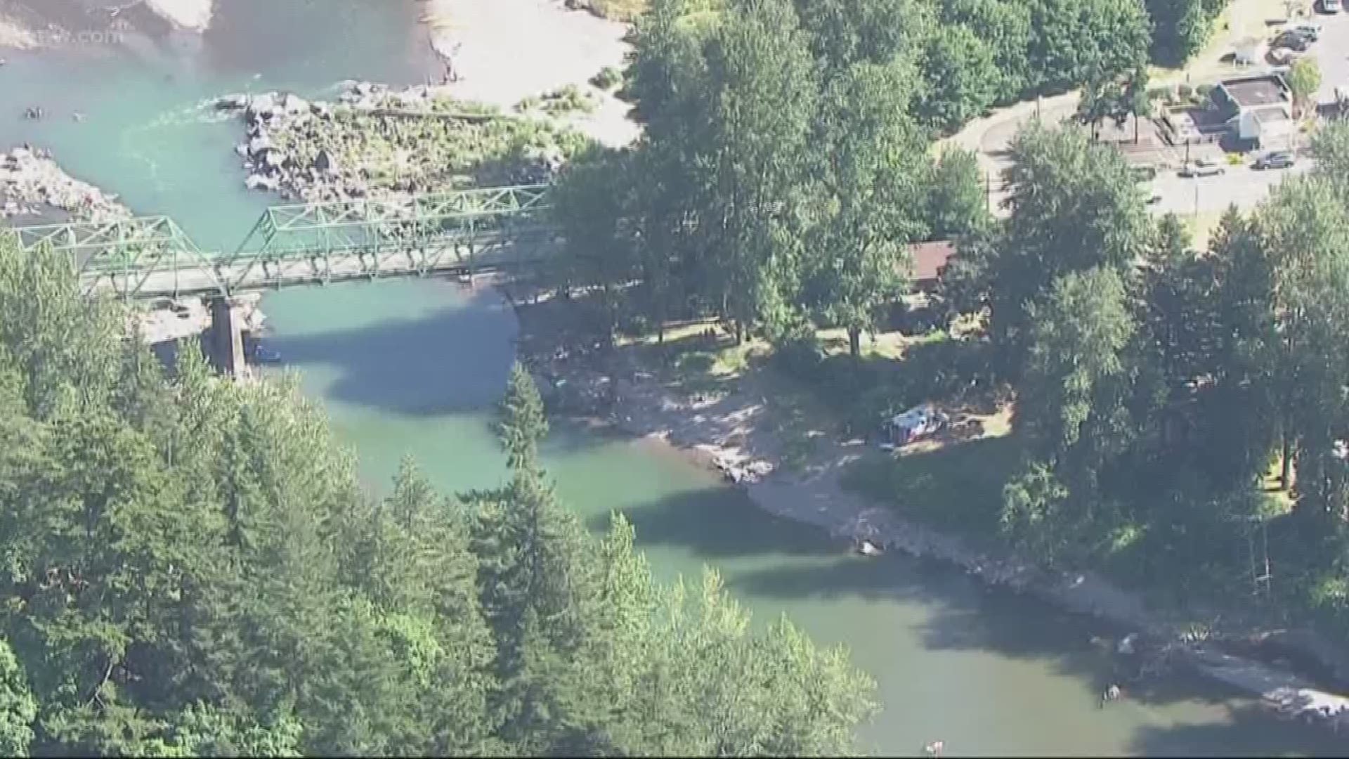 A person was pulled out of the river and rushed to a hospital.