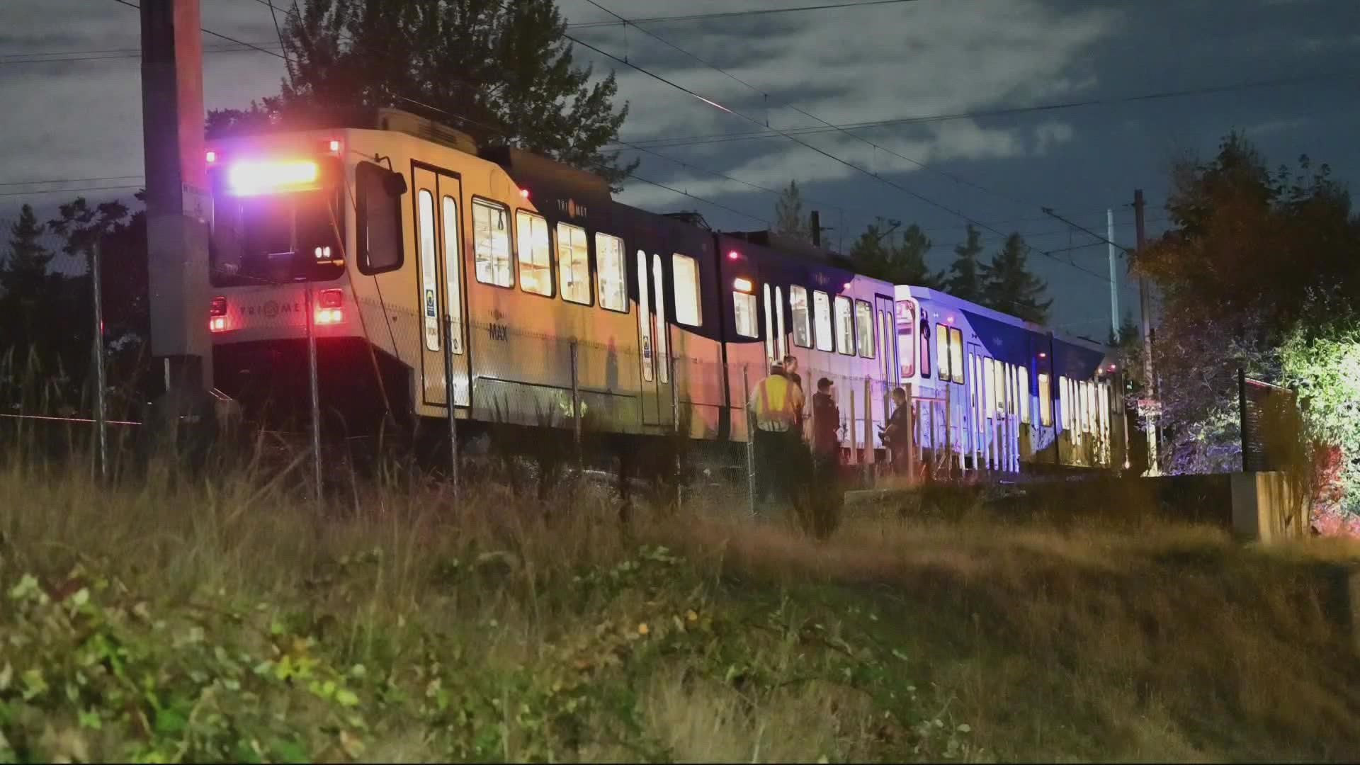 Investigators said the woman was sitting by the track when she was hit by the train.