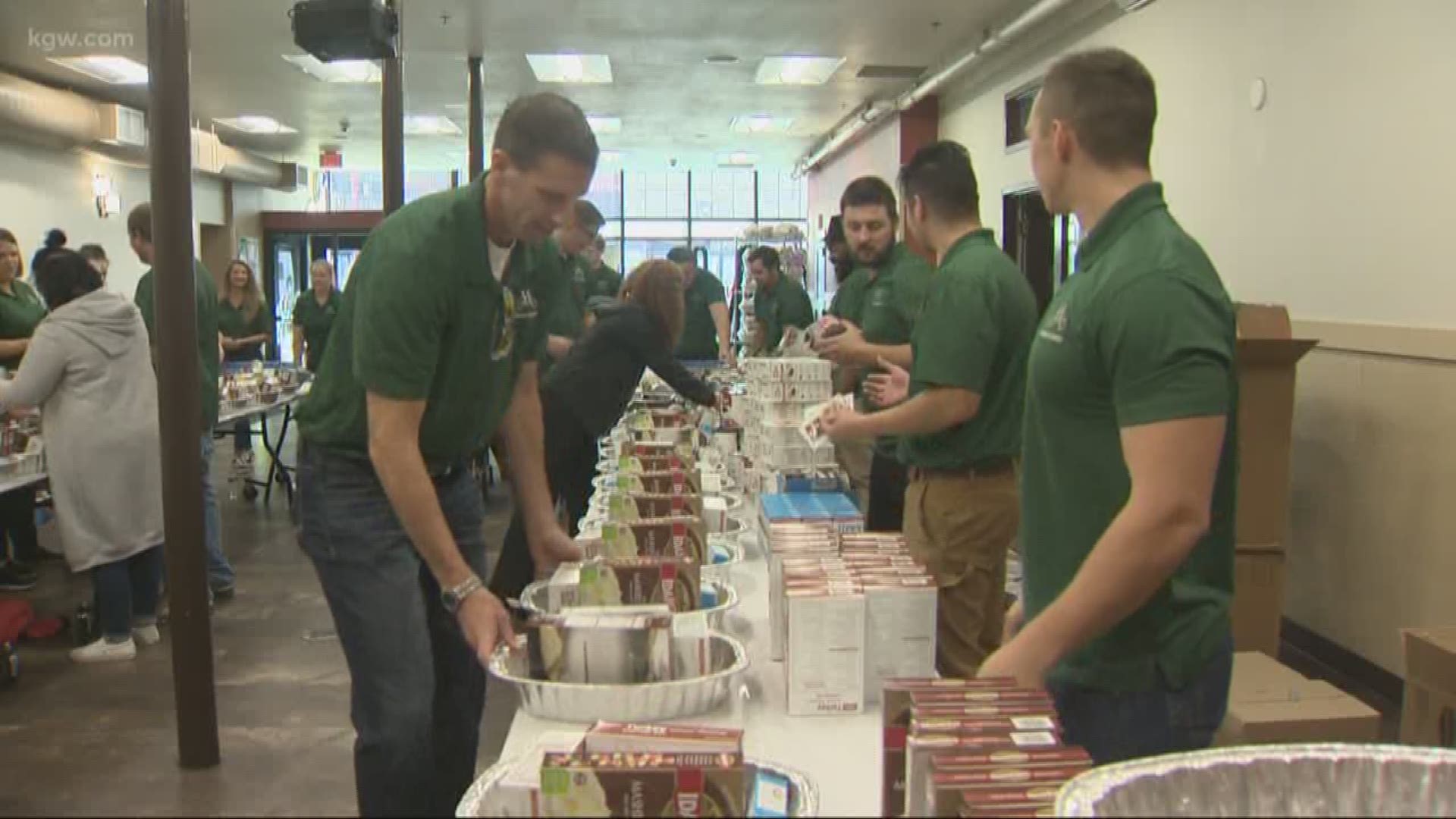 Volunteers put together, distribute meals