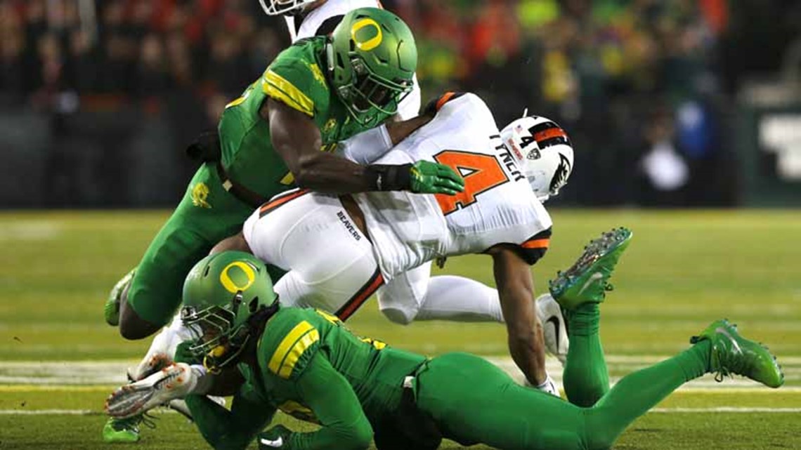 Driver arrested and charged in death of former Oregon football player