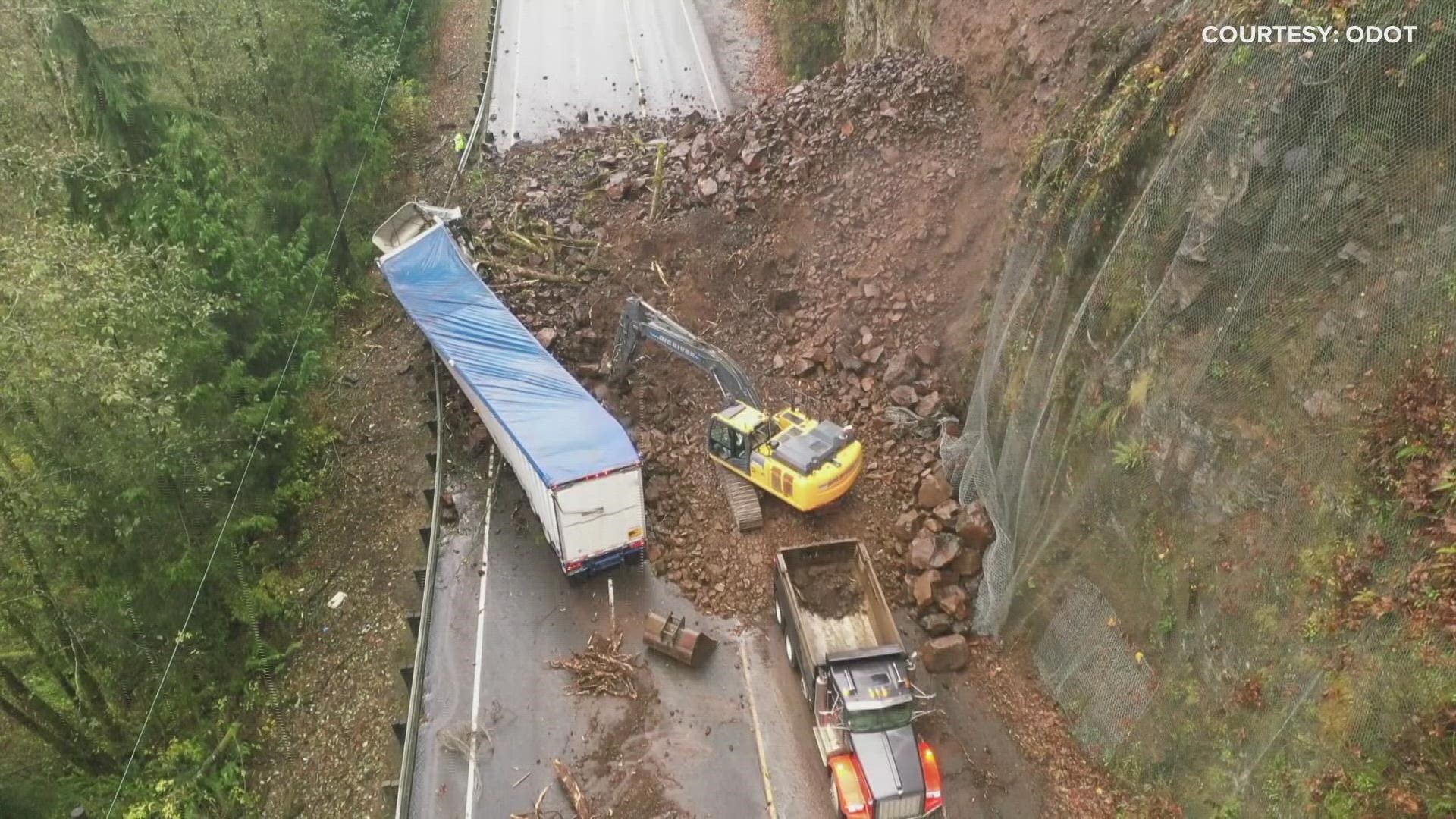 Drone video shows a landslide blocking Highway 30 between Astoria and Clatskanie. ODOT said at least ten truckloads of rock and mud slid onto both lanes of traffic.