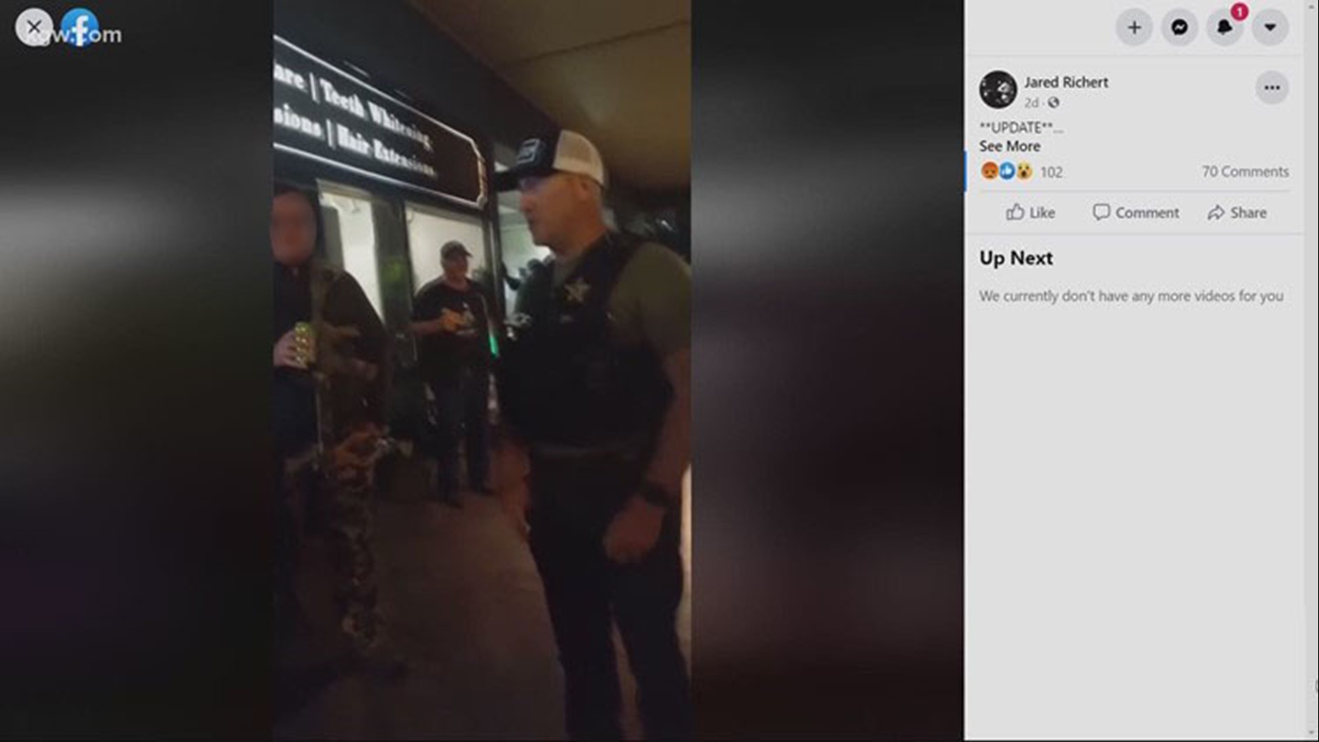 The video shows a Salem police officer asking a group of armed men to leave the sidewalk ahead of curfew. Critics said he appeared to be playing favorites.