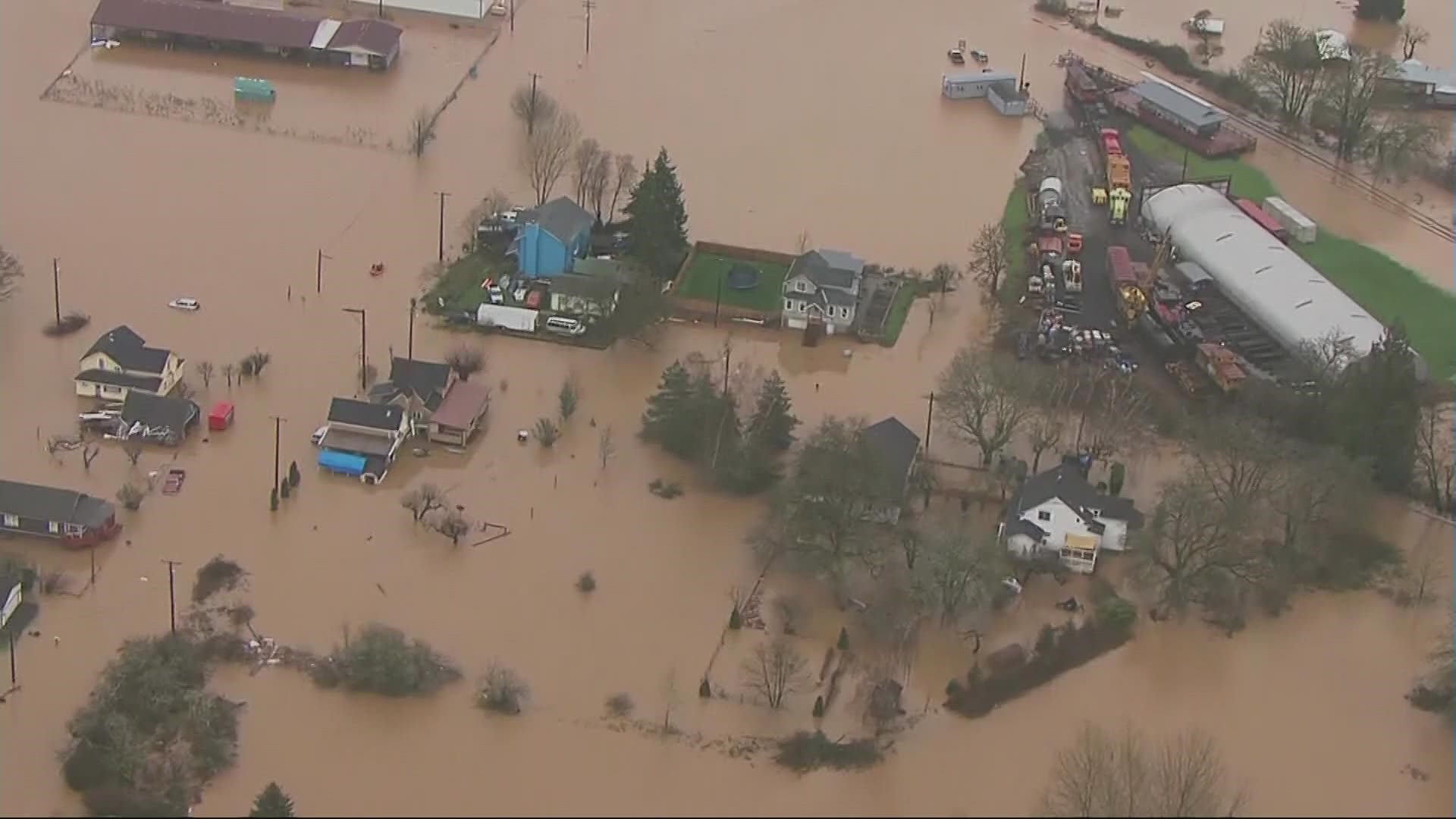 The Cowlitz and Chehalis Rivers overflowed Friday, causing widespread flooding in Centralia, Chehalis and Kelso and a temporary shutdown of I-5.