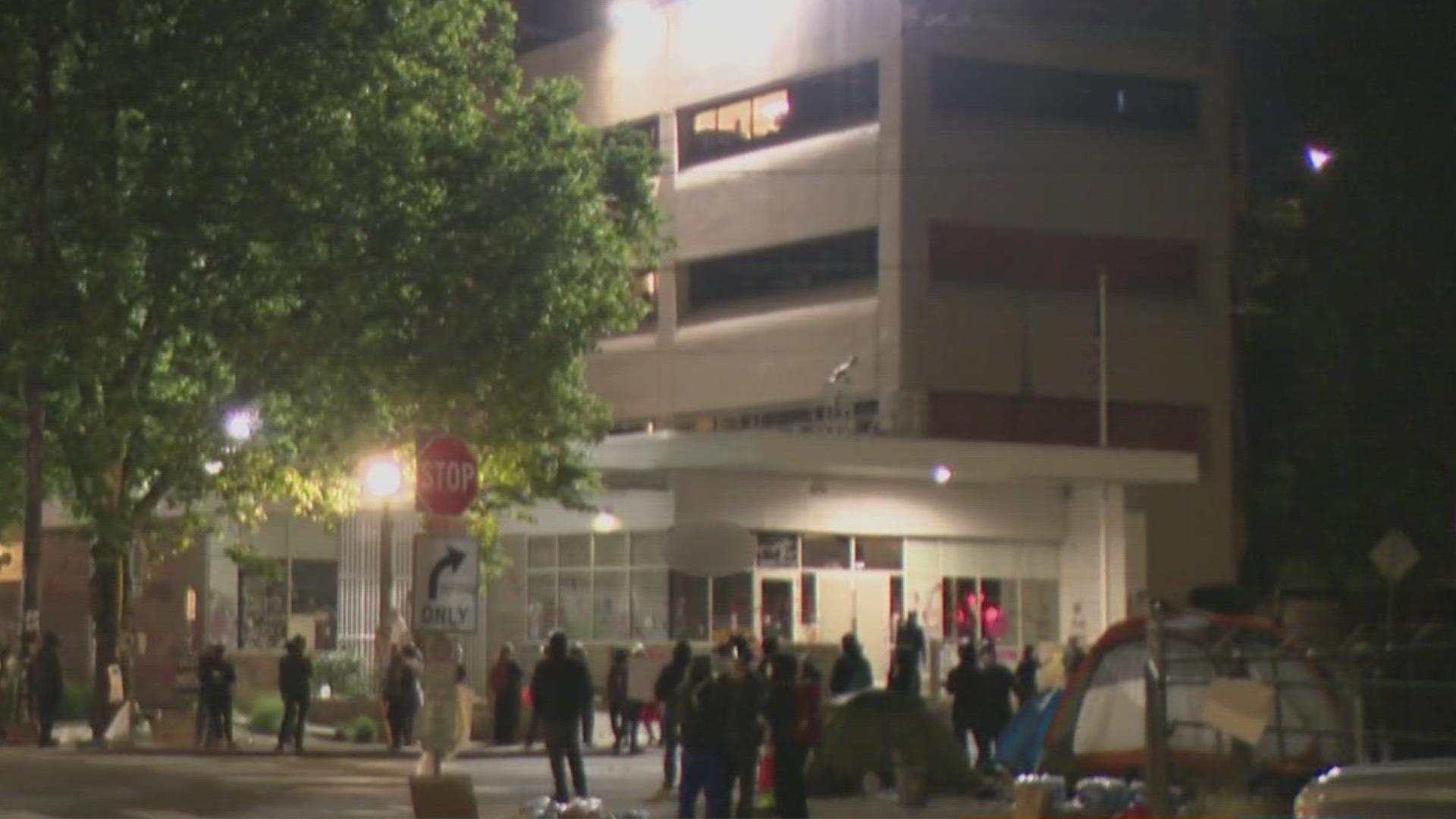 Four people were arrested following protests Sunday night outside the U.S. Immigration and Customs Enforcement (ICE) facility in Portland, police said.