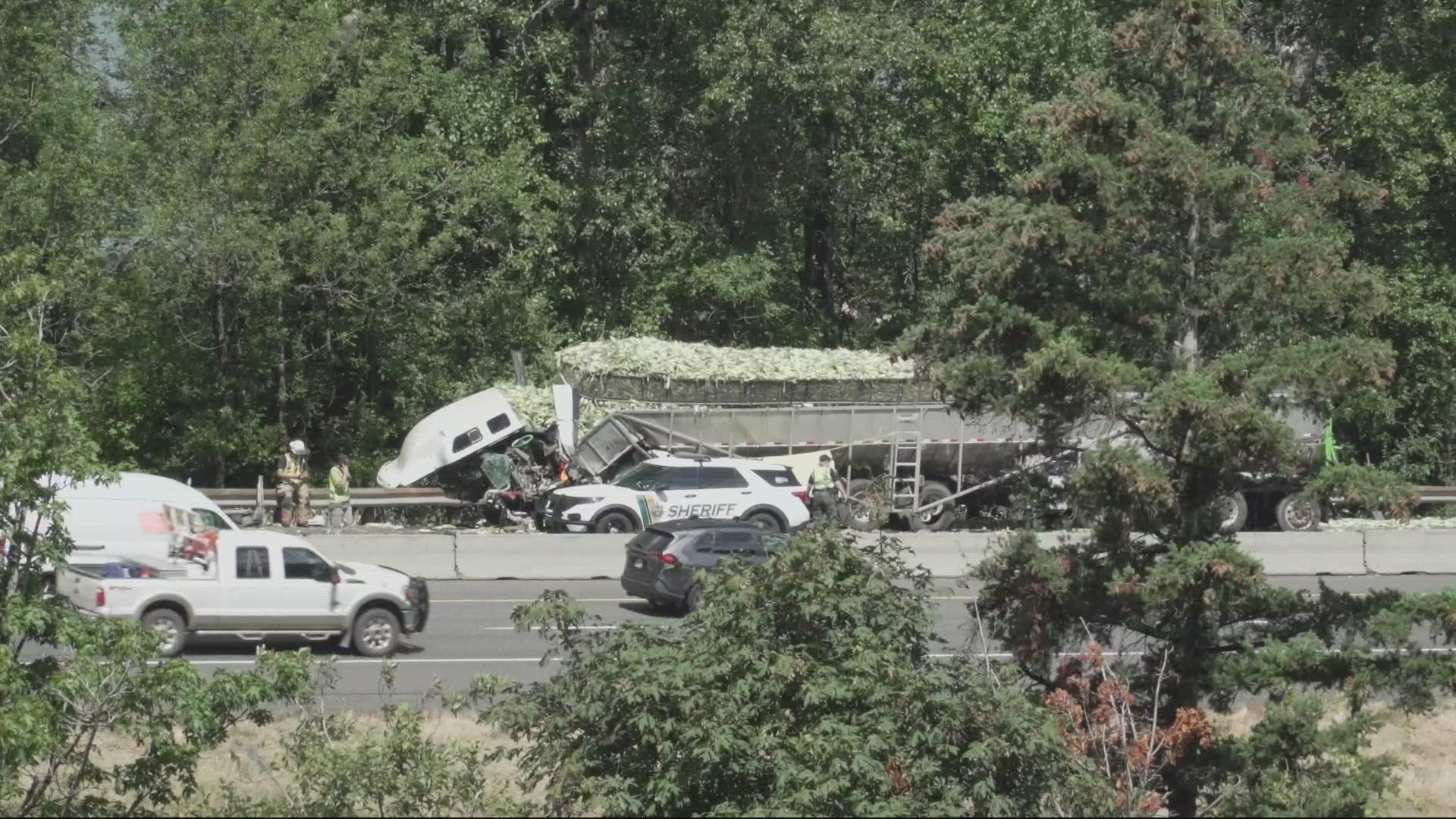 A semi-truck had been carrying produce and smashed into the guard rail west of Multnomah Falls, spilling corn all over the freeway.