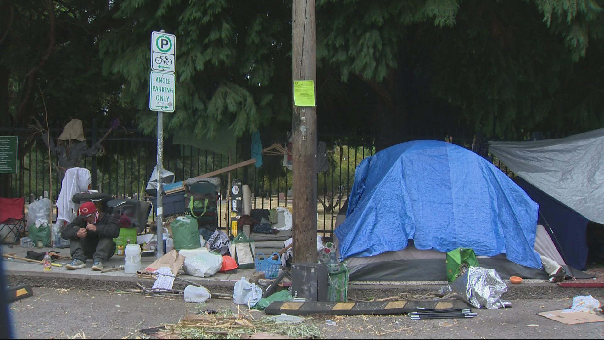Families with loved ones buried at the southeast Portland cemetery are concerned about poor conditions and safety issues with a growing homeless camp nearby.