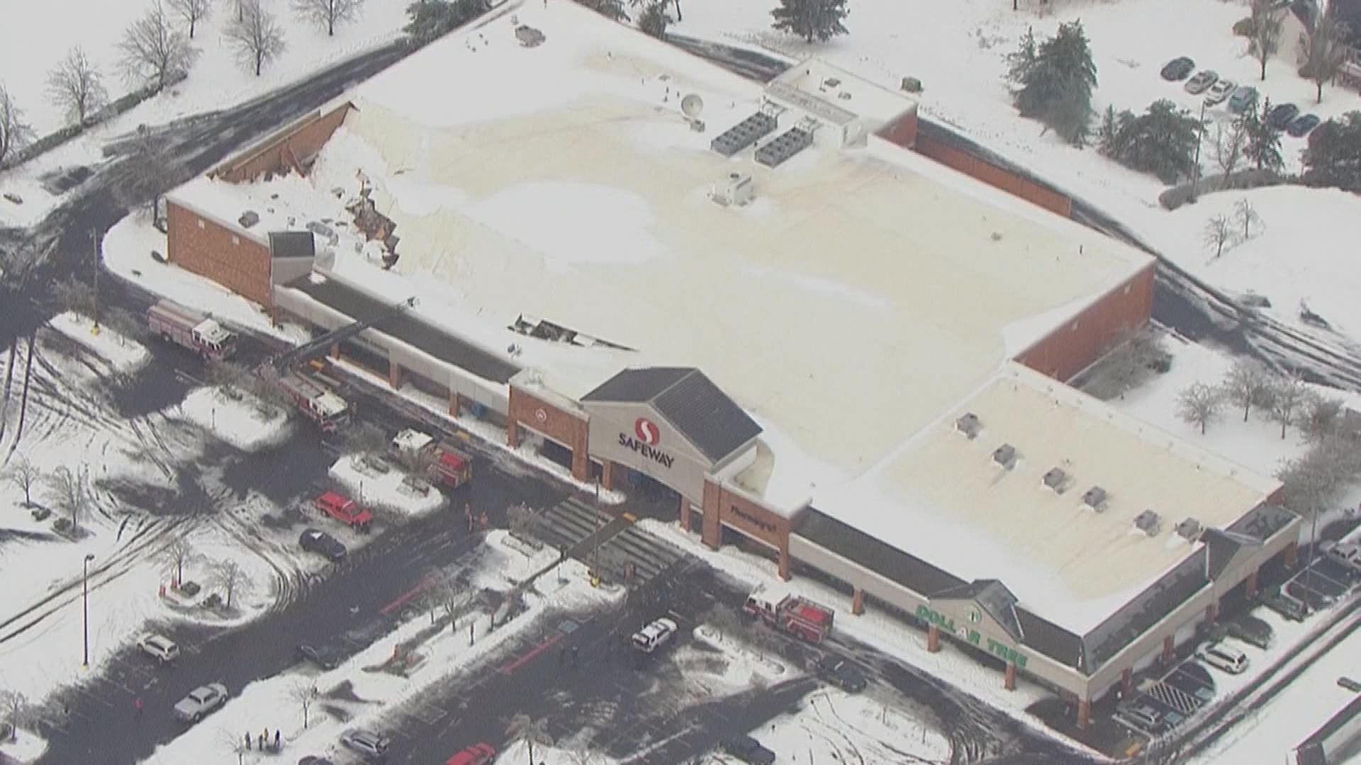 The Safeway store’s roof partially collapsed under heavy snow on Monday. Everyone in the store made it out safely and there were no reports of injuries.