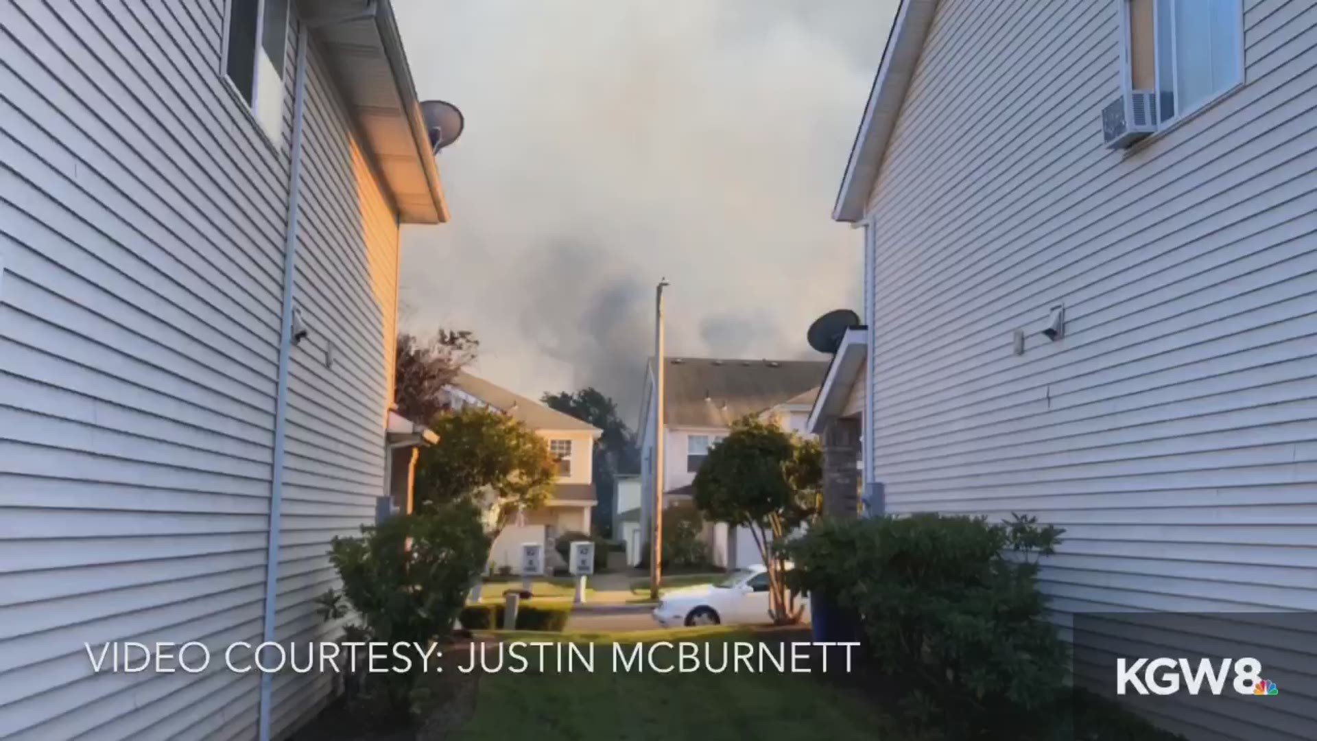 A video given to KGW by Justin McBurnett shows him battling the 5 alarm NE Portland fire with his garden hose as he awaited firefighter response.