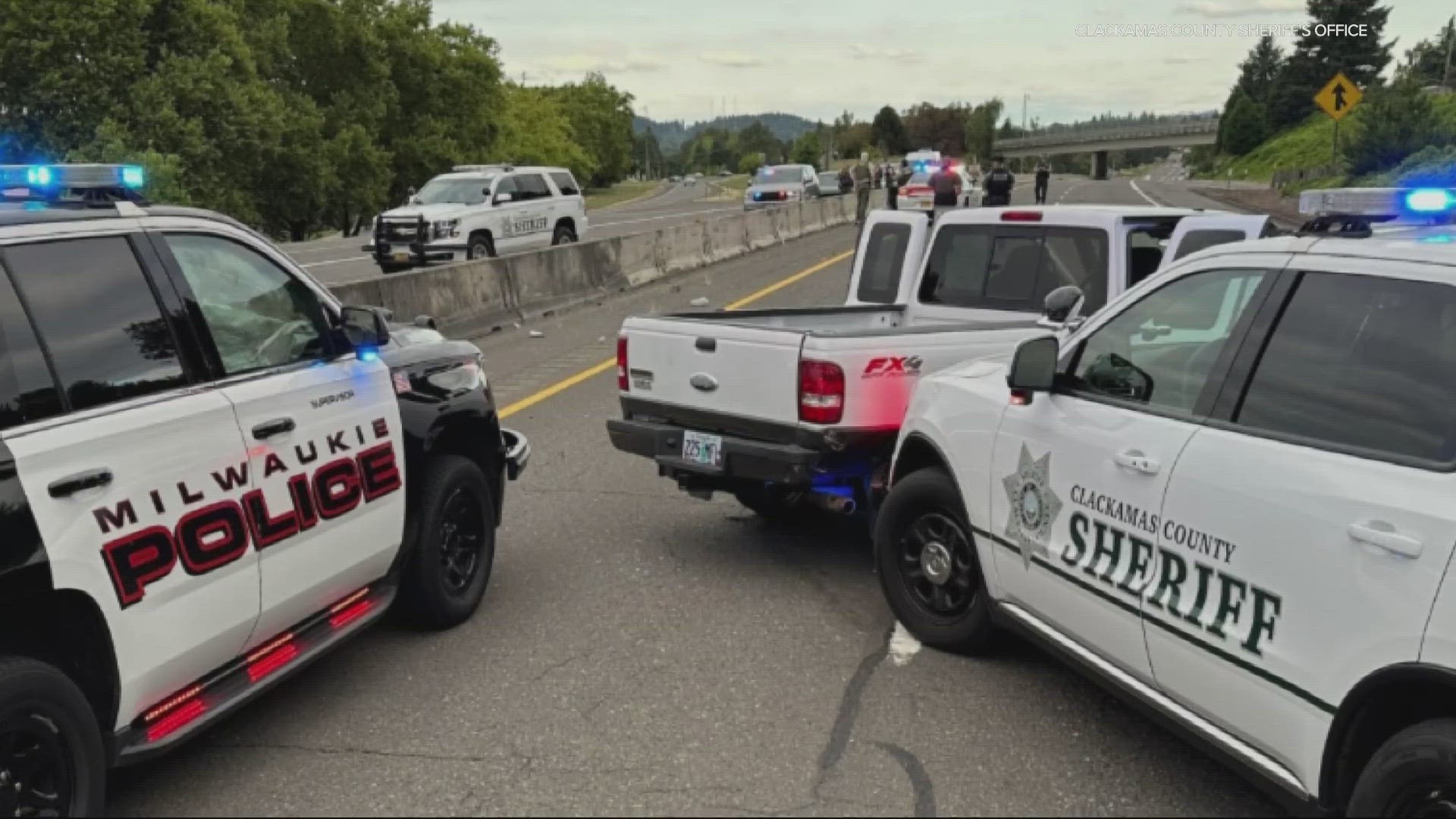 A Milwaukie Police officer was injured Monday evening when they were hit by a Clackamas County sheriff's vehicle during the pursuit of an armed robber.