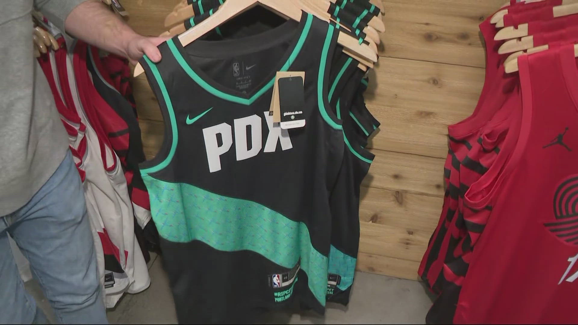 Portland Trail Blazers rolls out new Rip City gear at the Moda Center for the NBA season, including a 'Rip City Runs Deep' t-shirt and retro-style jackets.