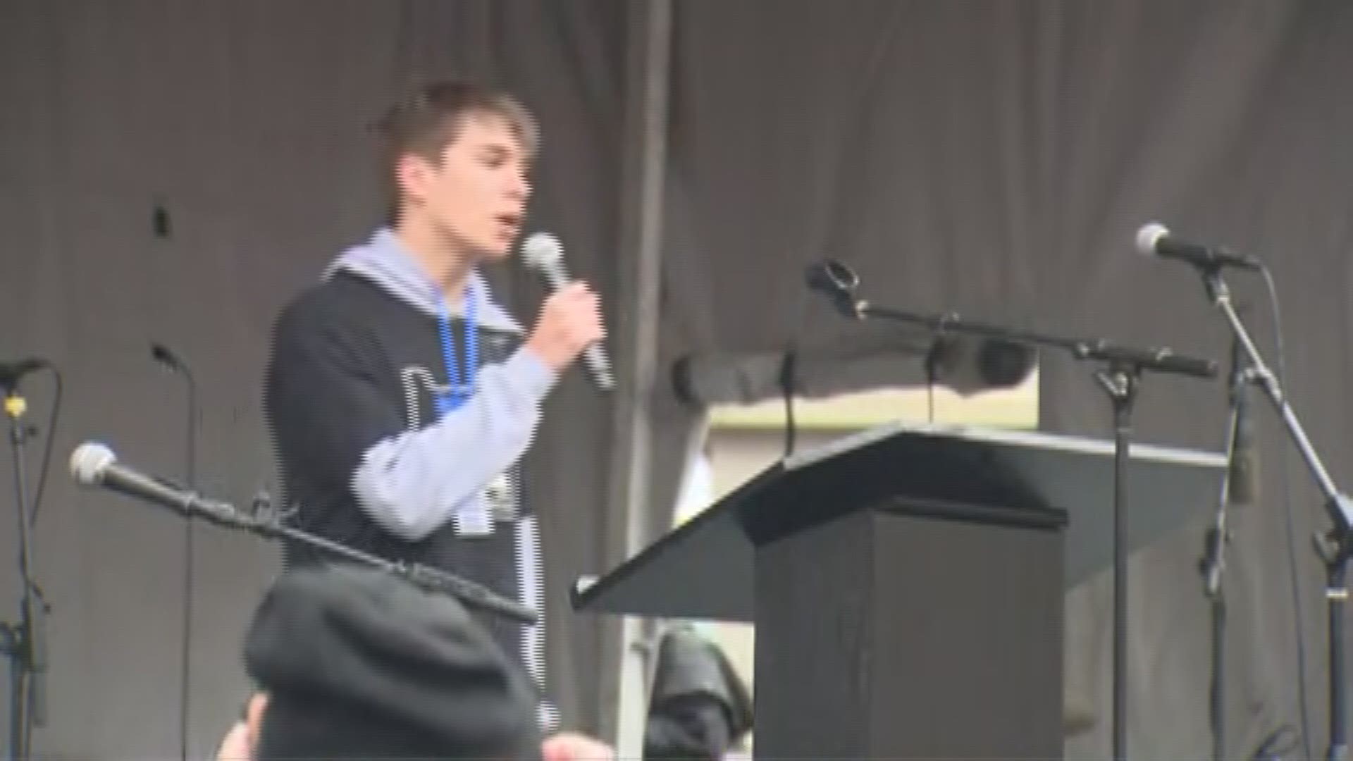 Student organizer Finn Jacobson calls out the National Rifle Association and President Donald Trump during a speech at Portland's March for Our Lives.