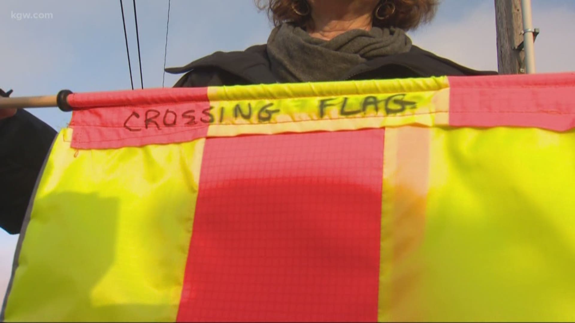 A Portland woman is making crossing flags to leave at the site of a serious crash, hoping it'll make the intersection safer for pedestrians.