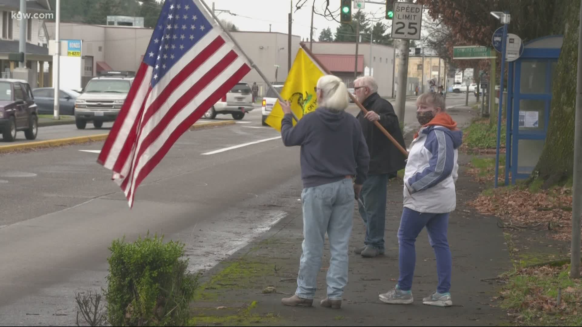 Hundreds of people rallied outside the Cowlitz County Courthouse to support owners of a Longview restaurant that defied orders to remain closed to indoor dining.
