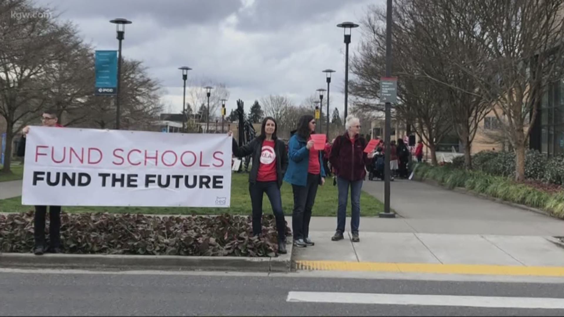 More than 60 people, clad in red, gathered at the Portland Community College Cascade campus to protest the proposed budget cuts in Oregon education.
