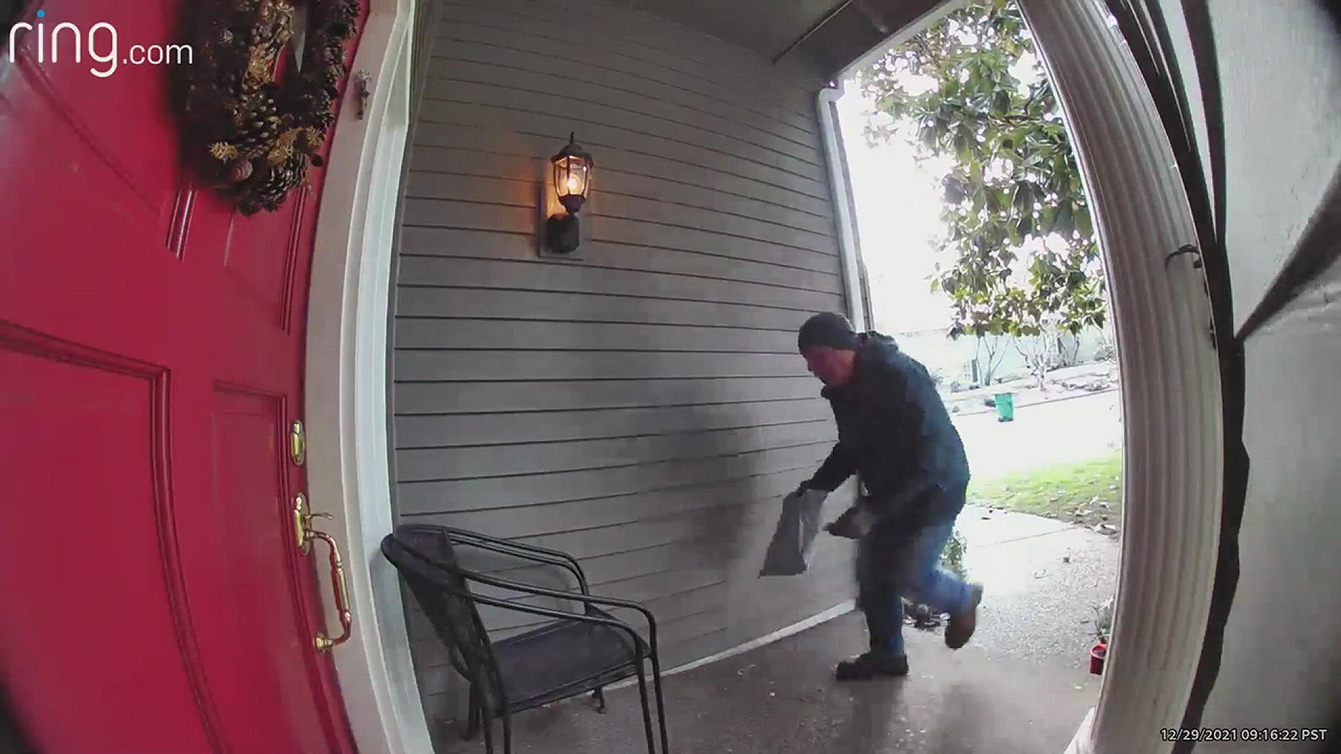 The homeowner was out of town and got a notification from his security system, showing video of the man returning the cash.