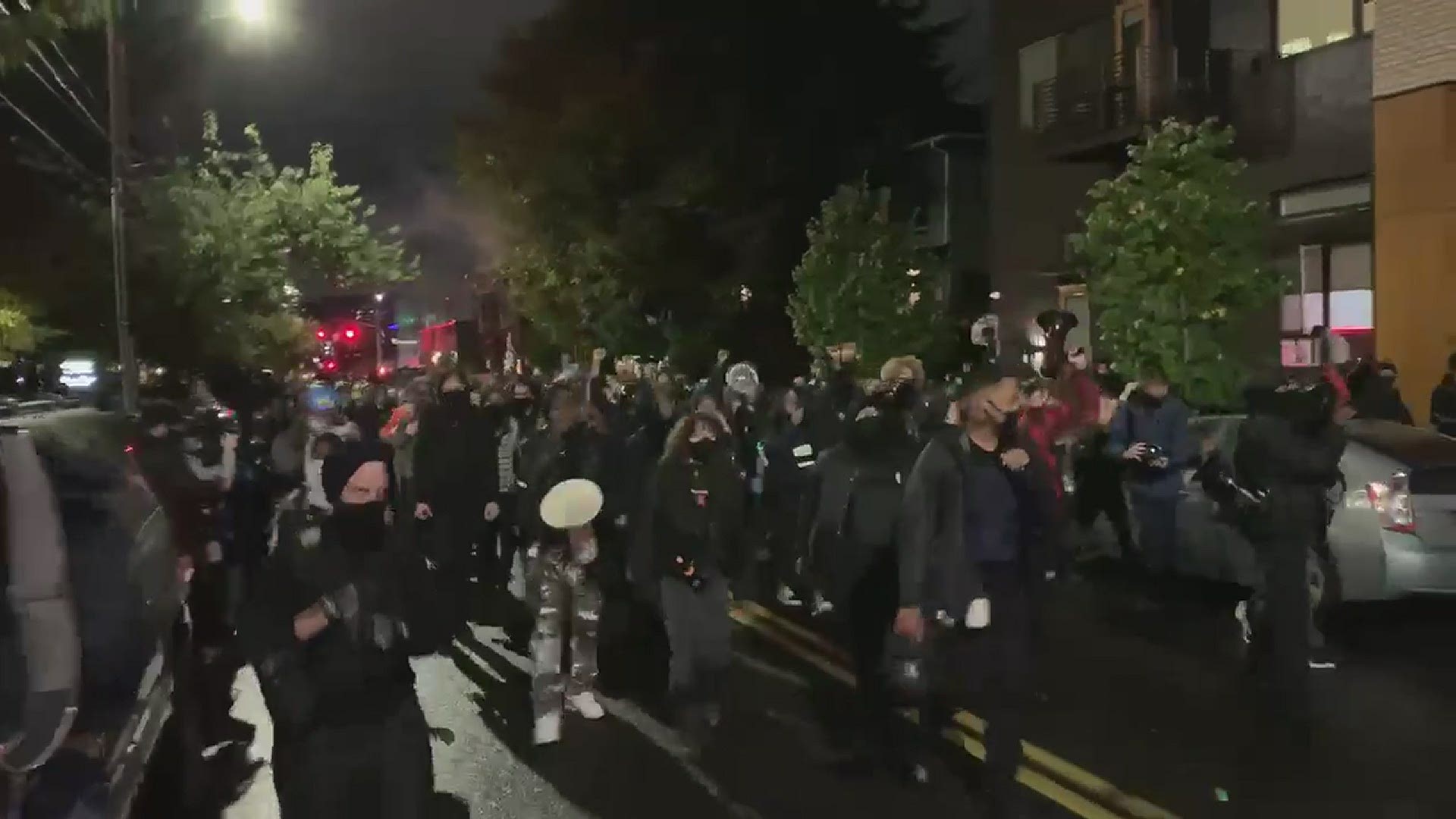 Crowds of people gathered at Revolution Hall in Portland before 8:00 p.m. and began marching through the streets of Southeast Portland Nov. 3.