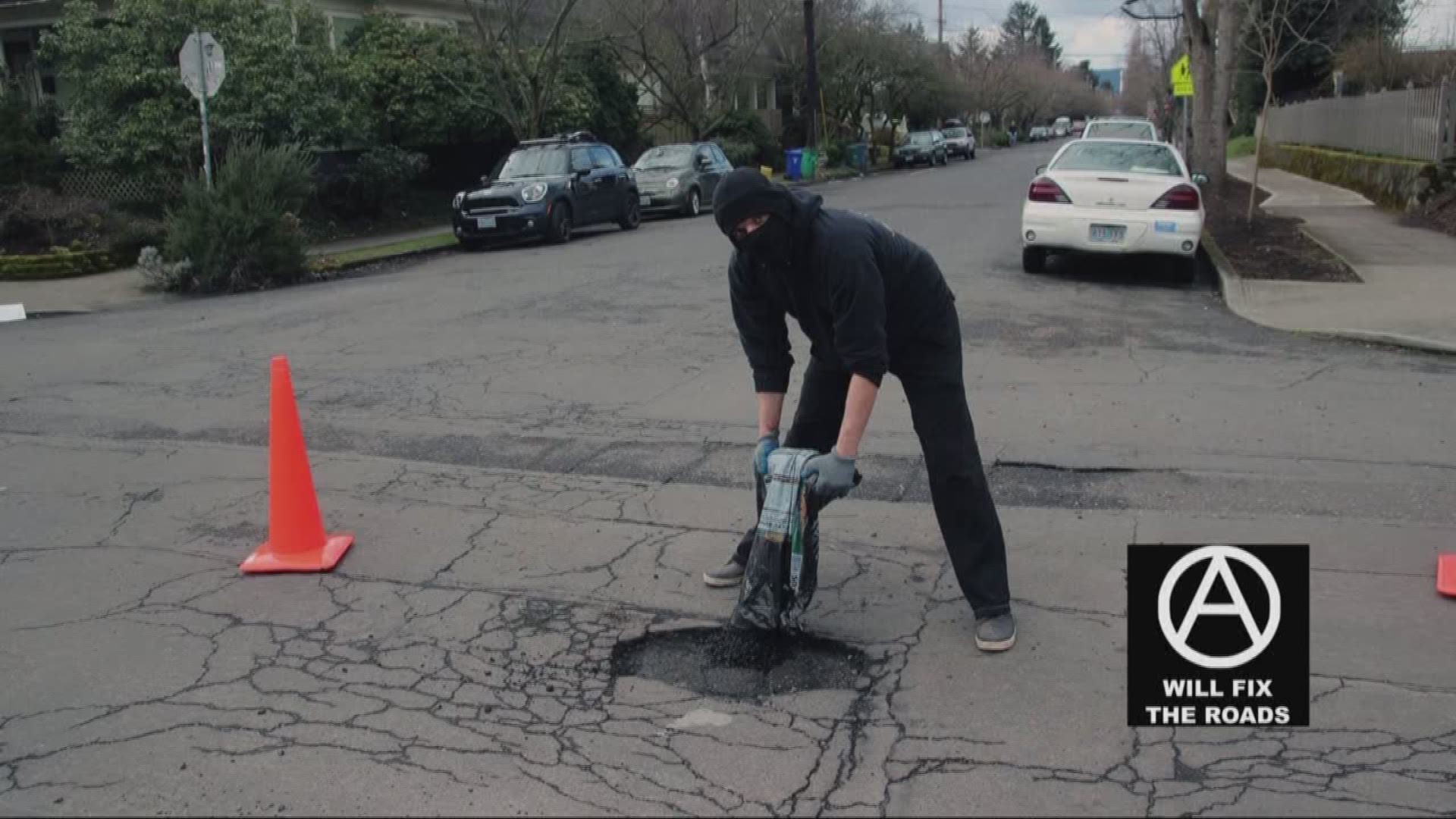 Anarchists patch potholes around city