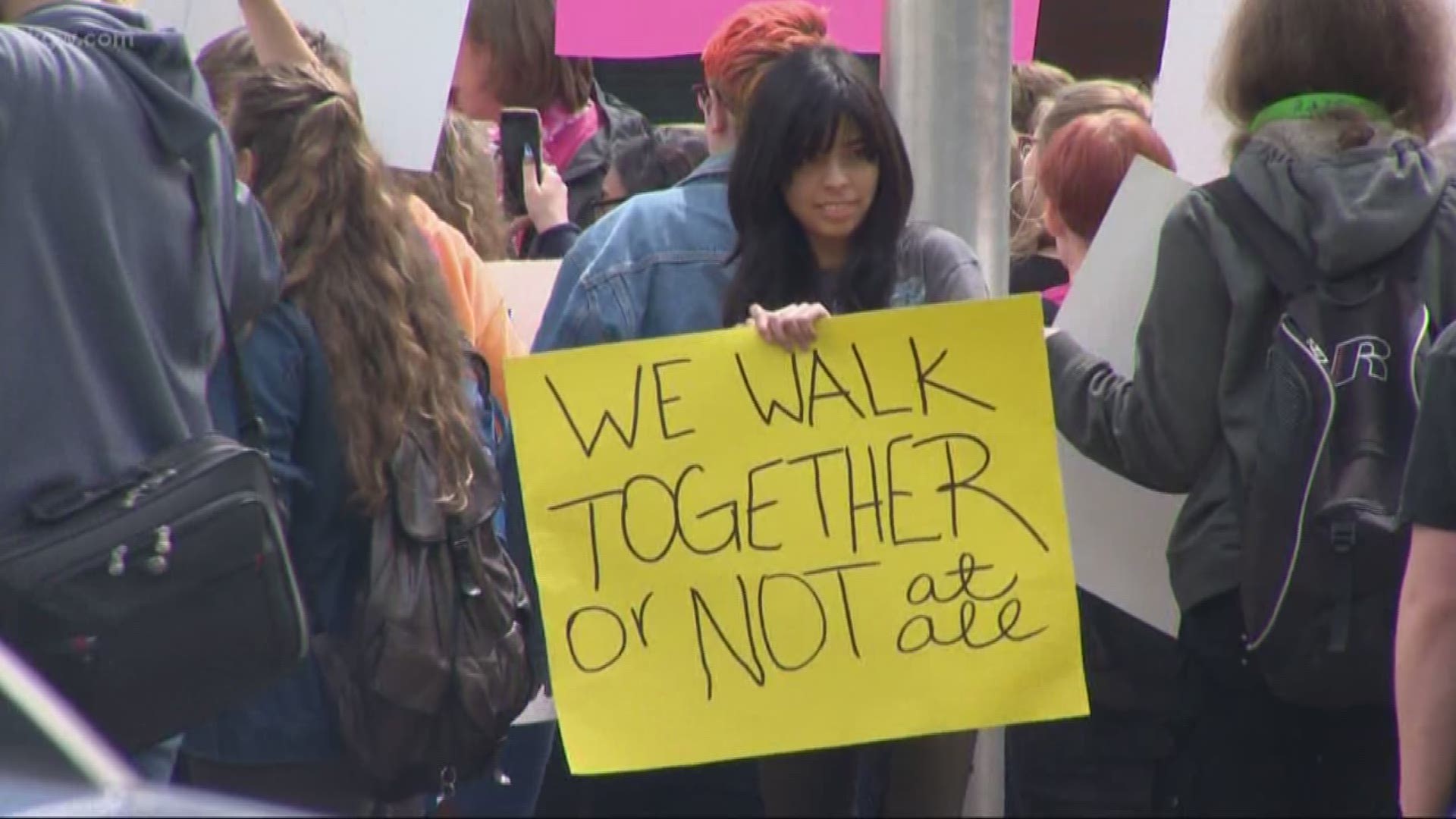 At least 100 students at Heritage High School in Vancouver walked out Friday in support of a student who was banned from walking at graduation.