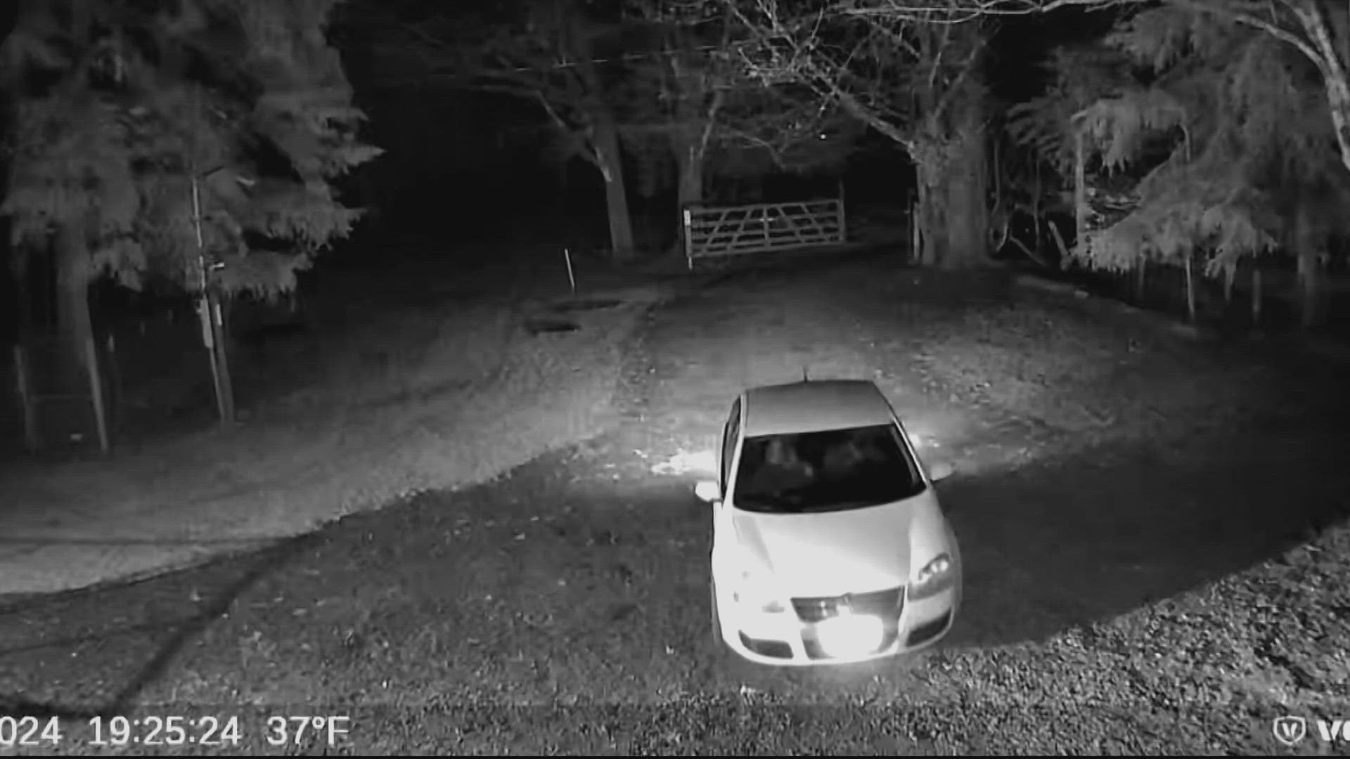 Surveillance video shows a man and woman wandering around the property a week prior, before the same car returns on November 28.