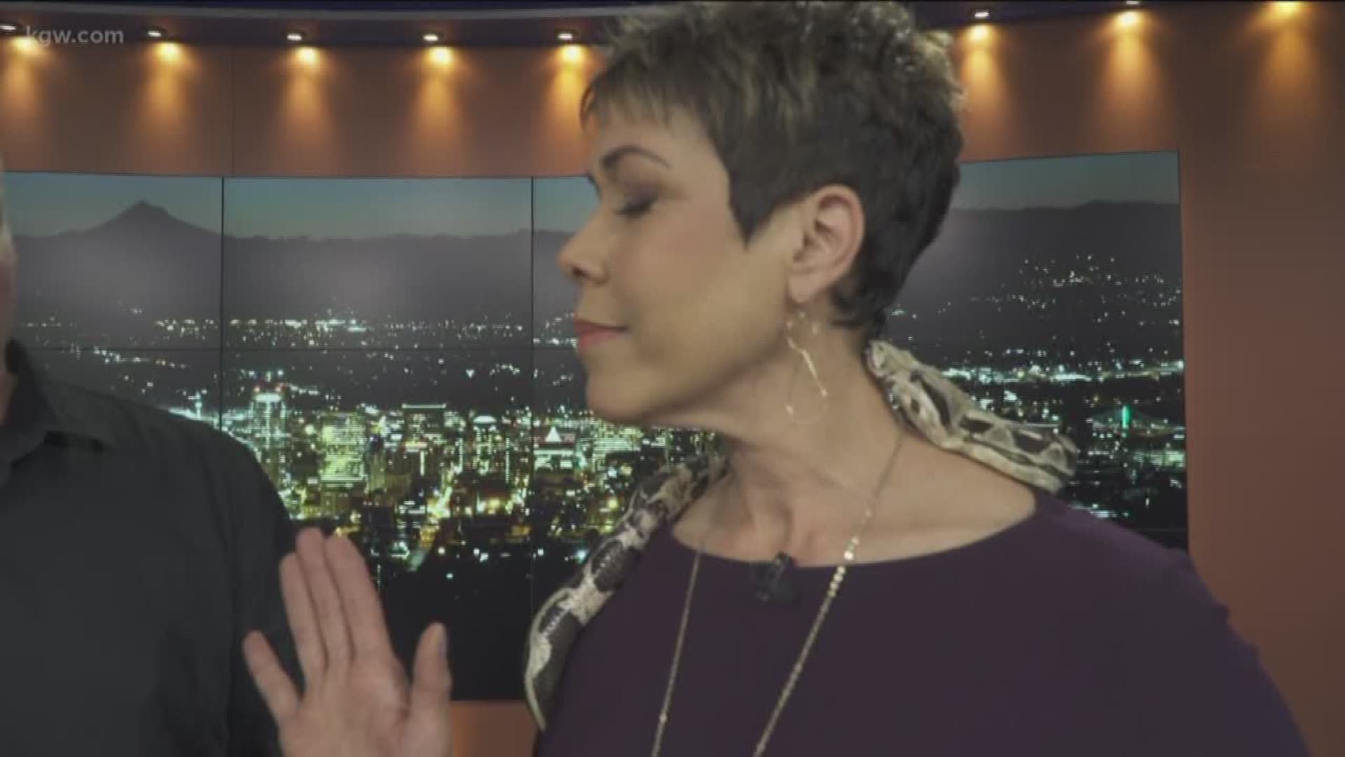 KGW Sunrise anchor Brenda Braxton tries to remain calm as a big snake wrapped around her like a shawl says hello.