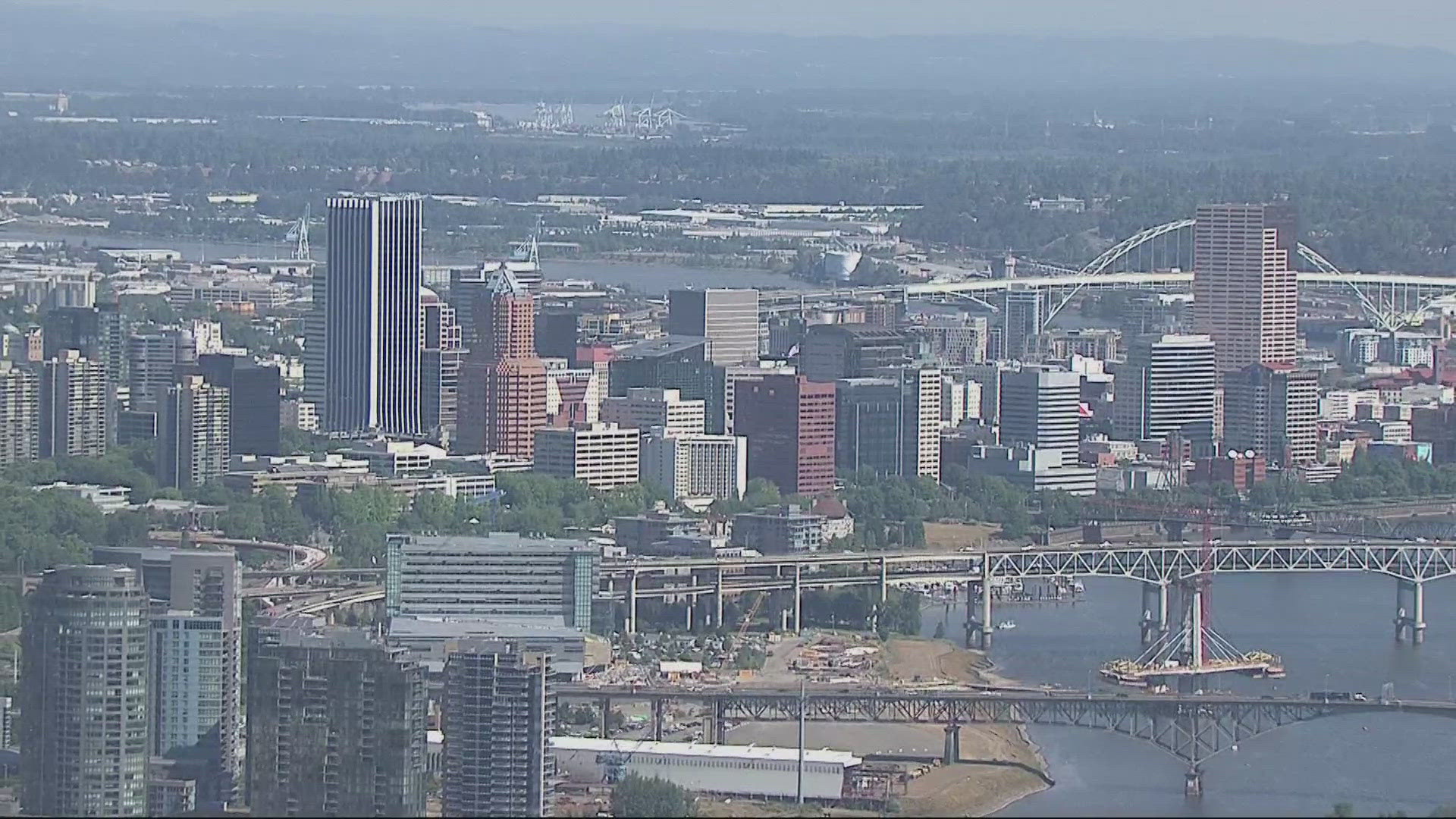 Real estate experts say the oncoming sales of the U.S. Bancorp Tower, known as "The Big Pink," and the PacWest building are signs of a lagging downtown Portland.