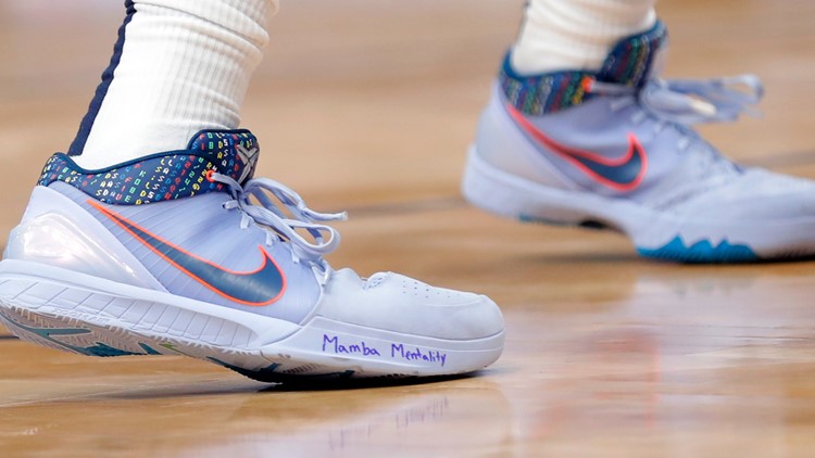 NBA stars write Kobe Bryant's name on their sneakers in emotional