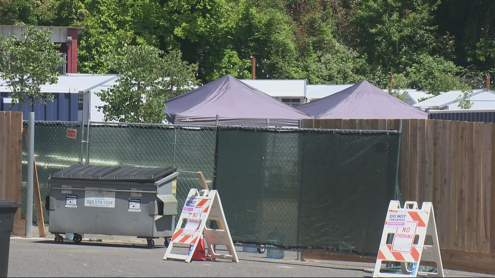 The federal government allowed the city of Portland to use the property for emergency management, and says the homeless village violates that agreement.