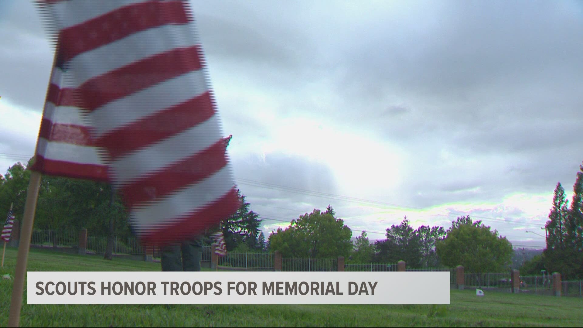 Scouts lines the Willamette National Cemetery with flags to honor veterans on Memorial Day.