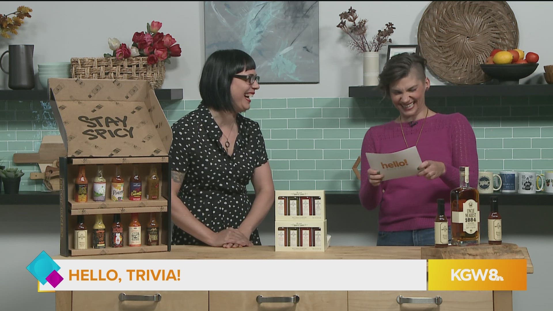 Sarah Marshall, owner of Marshall's Haute Sauce, plays Hello, Trivia! with a sample of haute sauce on the line