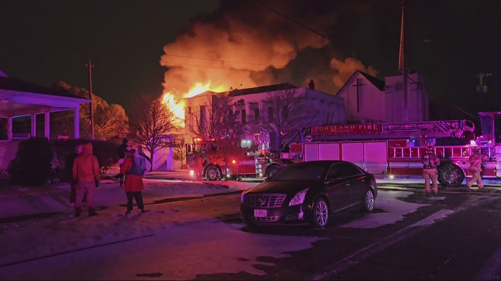 The fire began in the church gym and spread to a nearby house. Fire crews had to pull back from the gym when the structure partially collapsed.