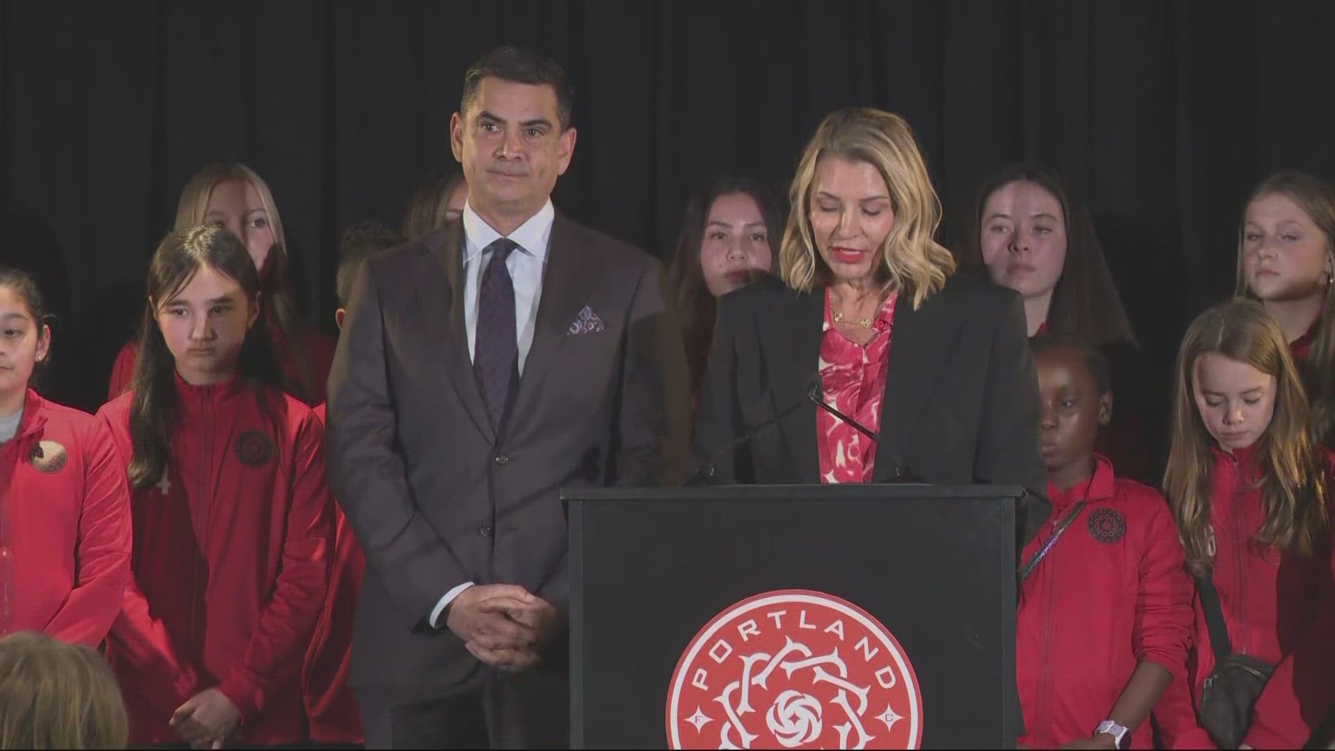 Members of the Bhathal family, owners of RAJ Sports, stood with Thorns management Monday in a press conference at Providence Park.