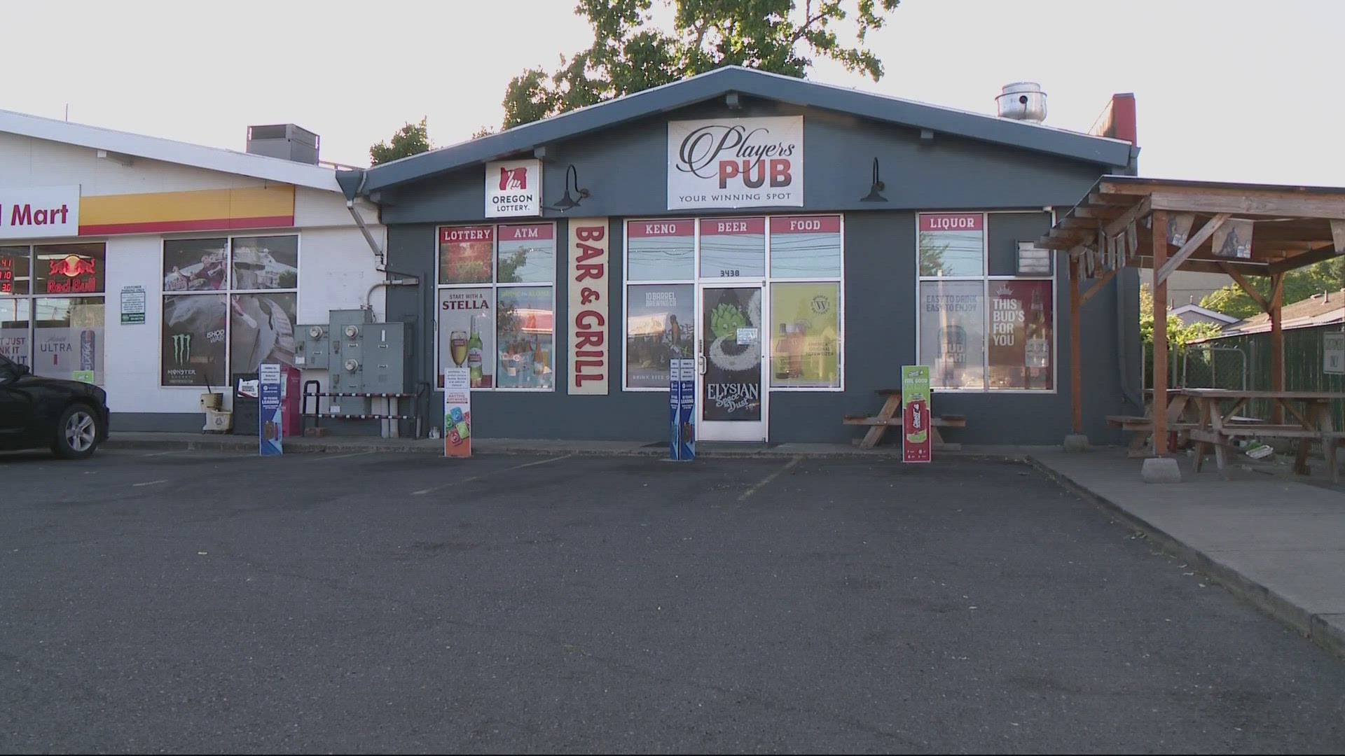 The man robbed Player's Pub PDX on Northeast 82nd avenue early Wednesday, then took a woman hostage and stole her car, police said.