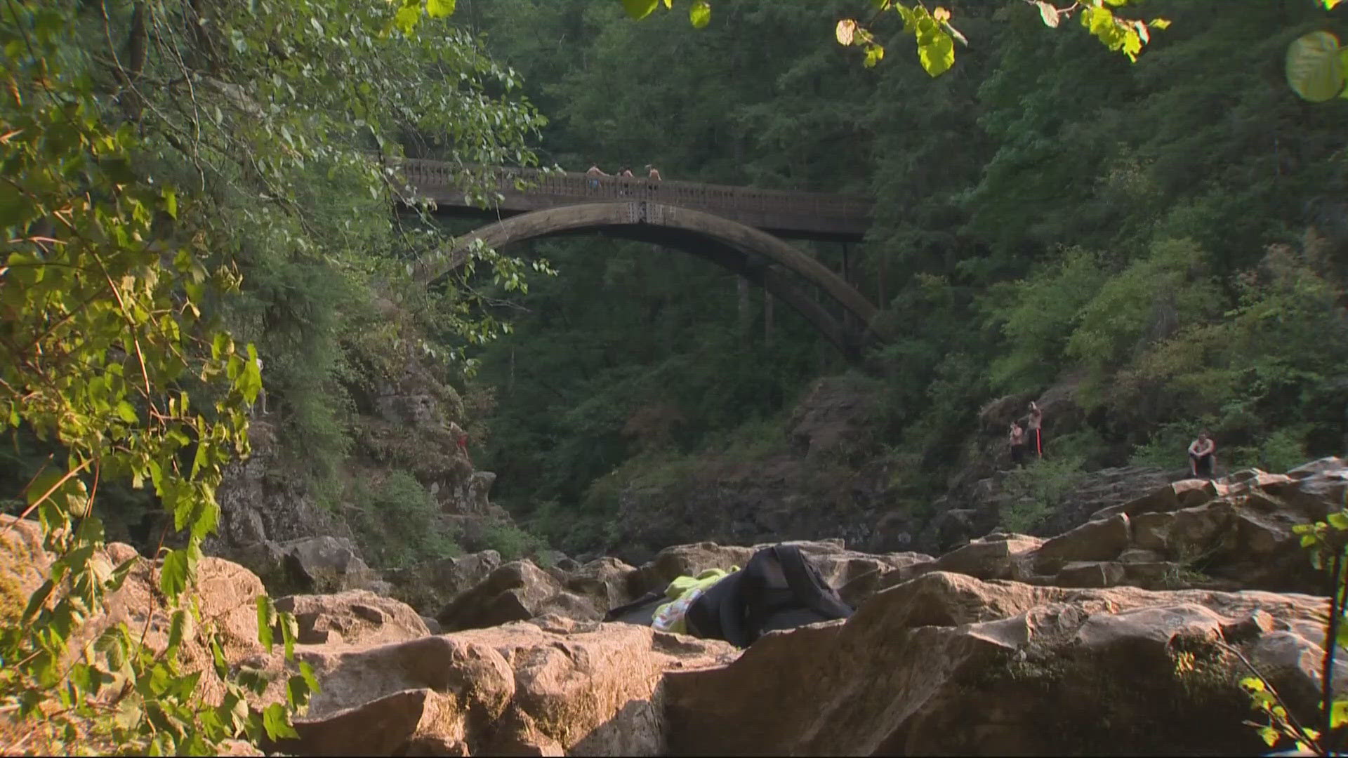 Officials say the man fell off a cliff then hit rocks at the bottom before tumbling into the water